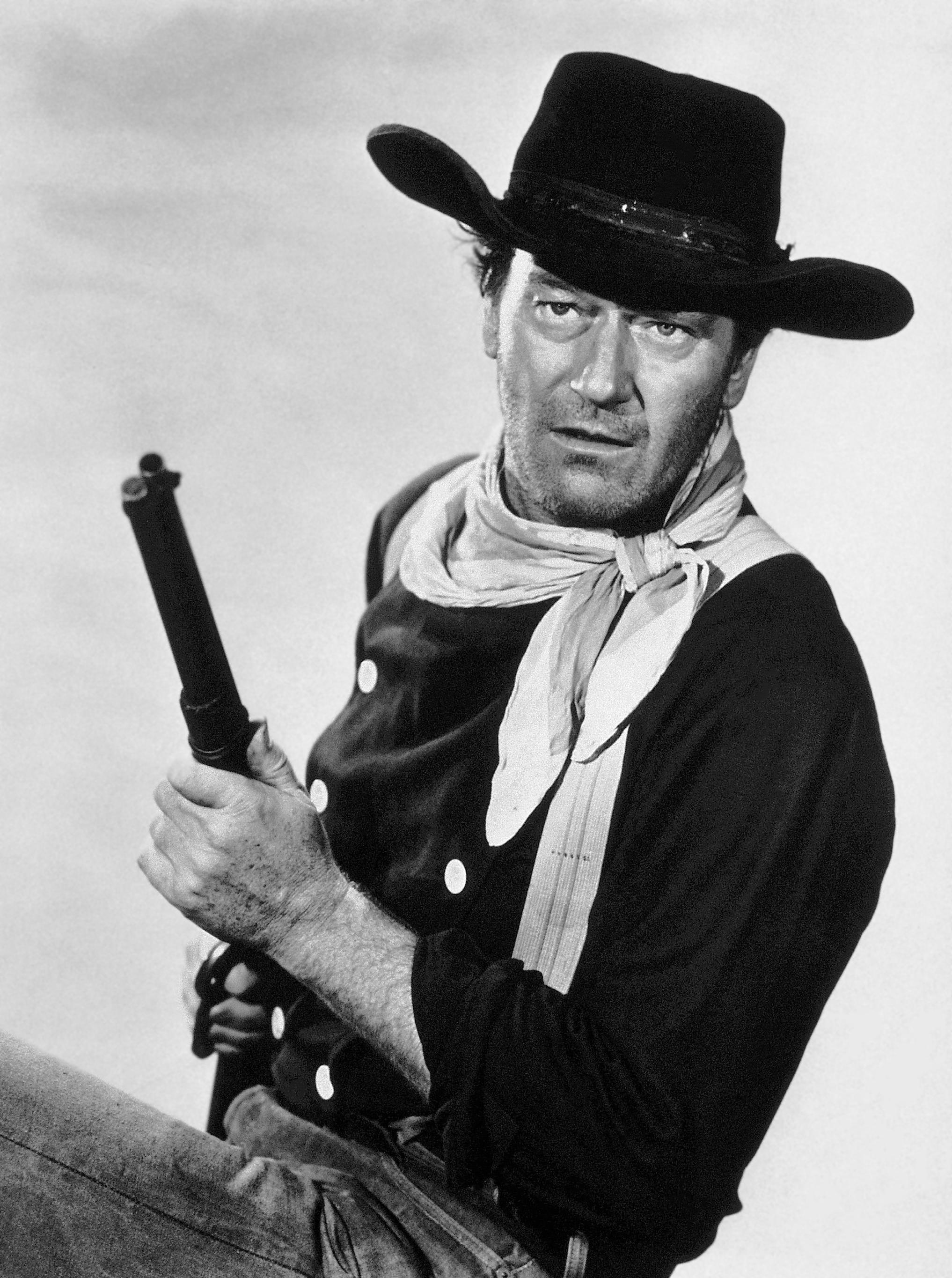 Unknown Black and White Photograph - John Wayne with Gun in "The Searchers" Globe Photos Fine Art Print