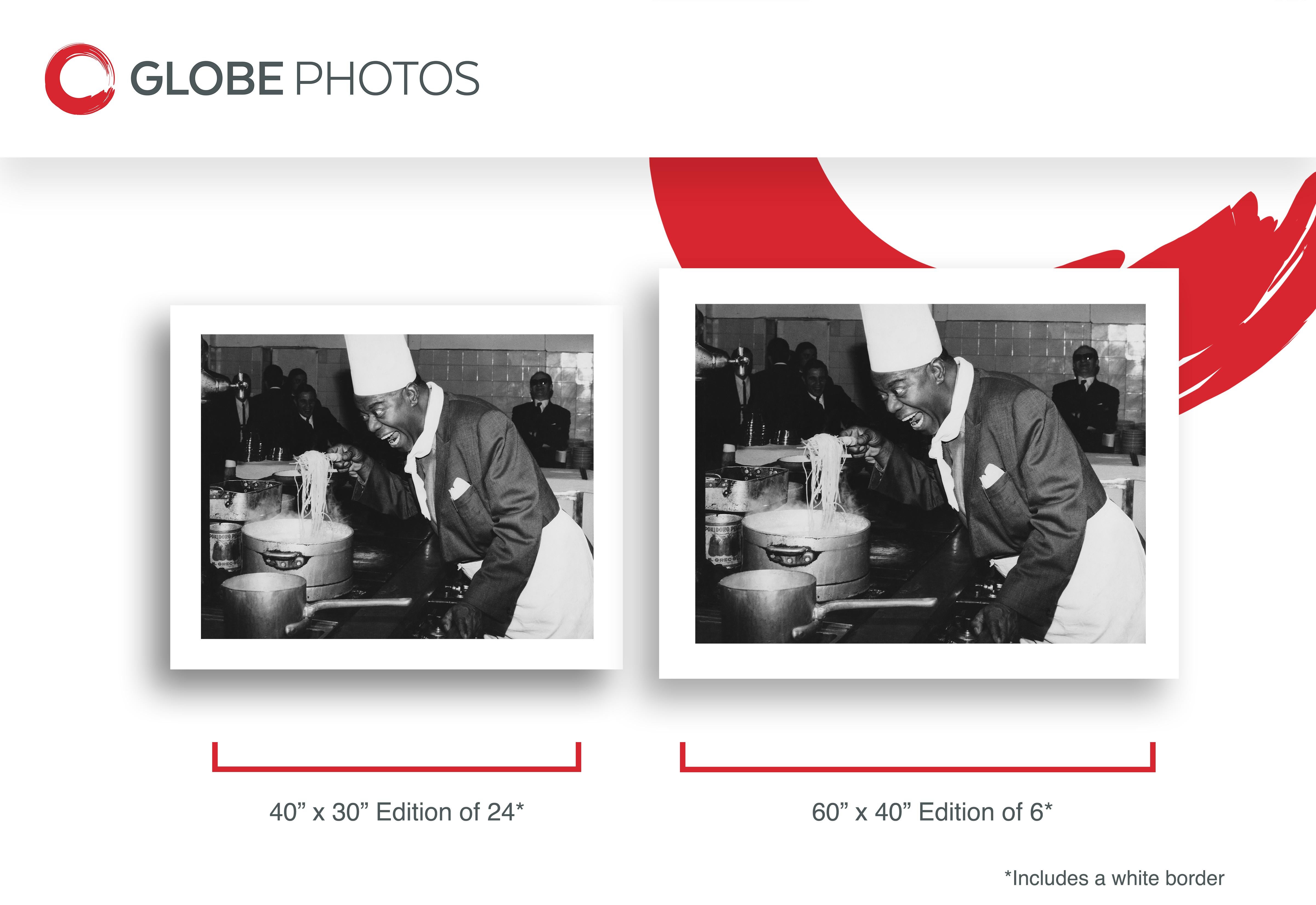 Louis Armstrong: Chef in the Kitchen - Black Black and White Photograph by Unknown