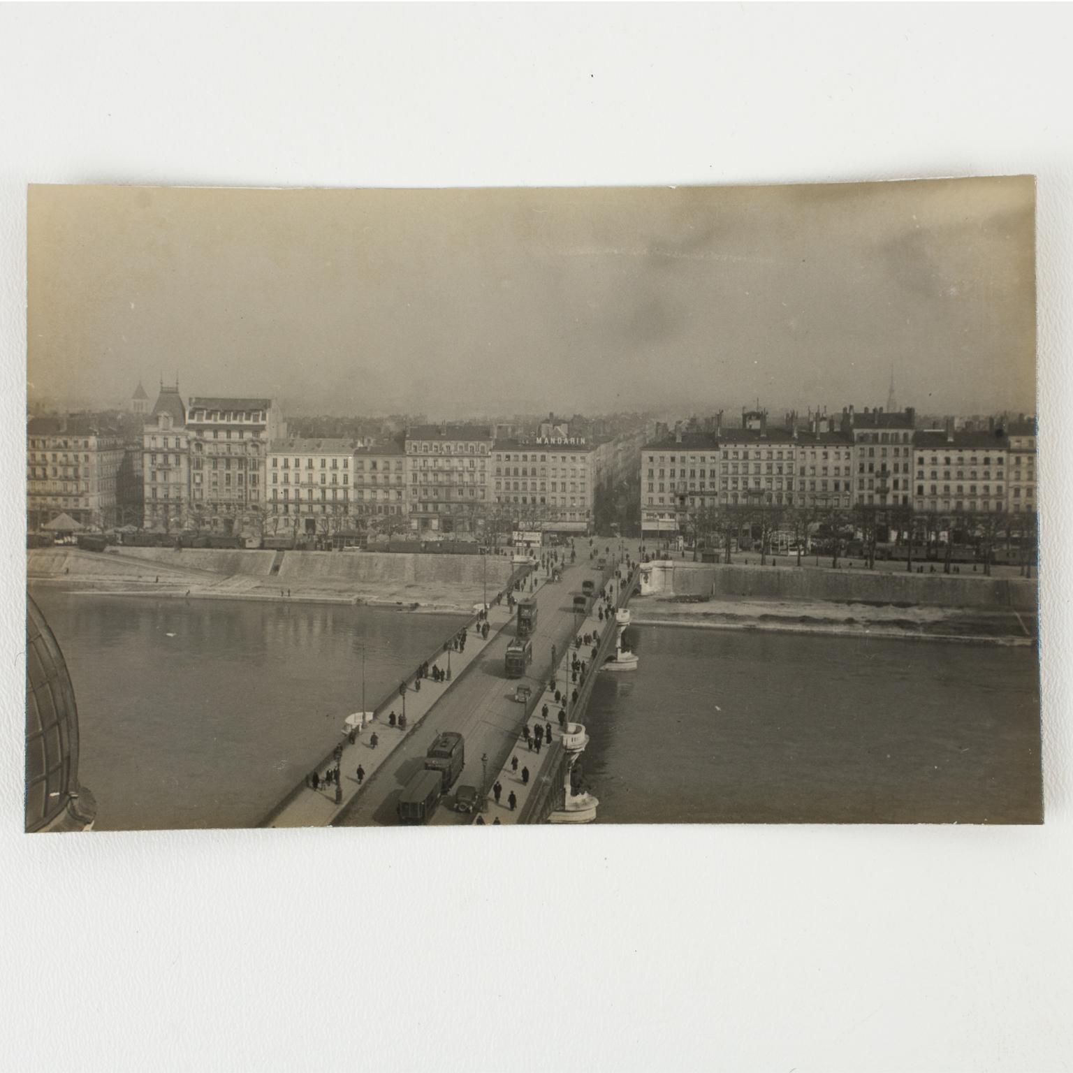 A unique original silver gelatin black and white photograph. View of a bridge over the Rhone River in Lyon, France, March 1927. 
The view of the Pont de l'Université in Lyon, France, was taken from the roof of The Galerie Lafayette Department Store,