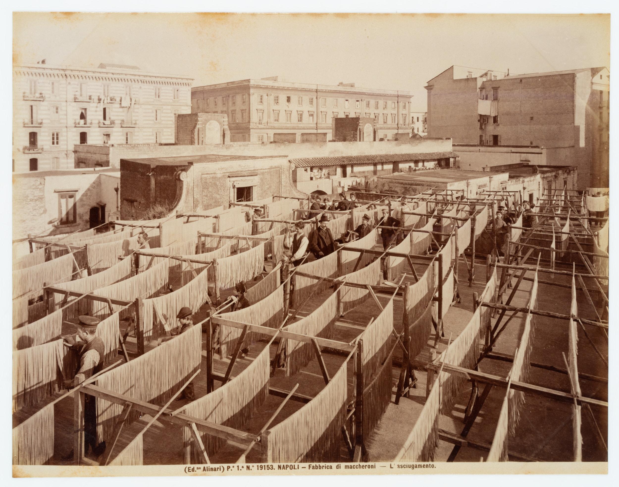 Fratelli Alinari (19th century): Maccheroni factory Insight into pasta production with drying pasta lines in the sun and workers, Naples, c. 1880, albumen paper print

Technique: albumen paper print

Inscription: lower left signed in the printing