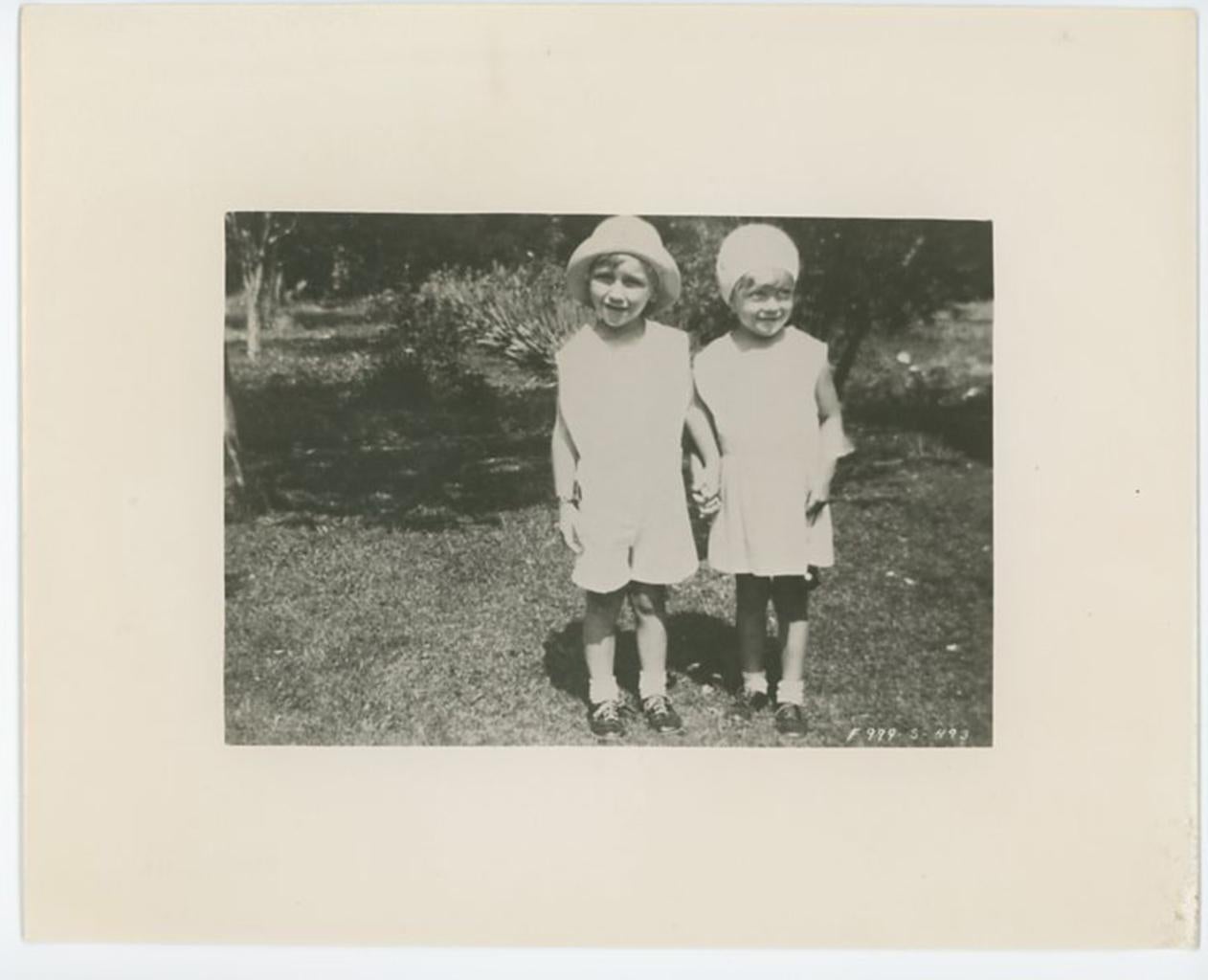 Unknown Black and White Photograph -  Marilyn Monroe as a Young child Holding Hands With a Friend