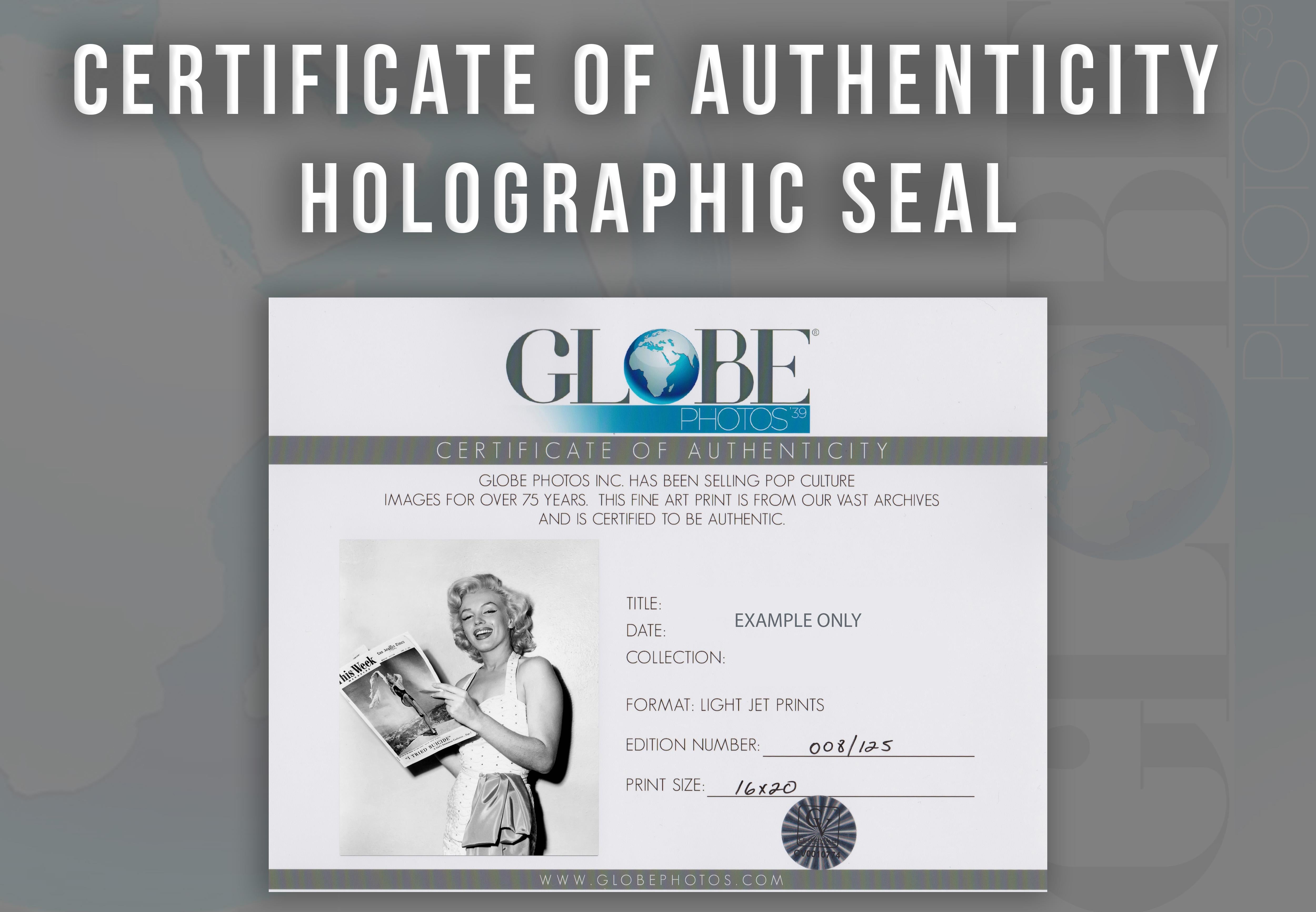 Marilyn Monroe Smling with Magazine Globe Photos Fine Art Print - Gray Portrait Photograph by Unknown