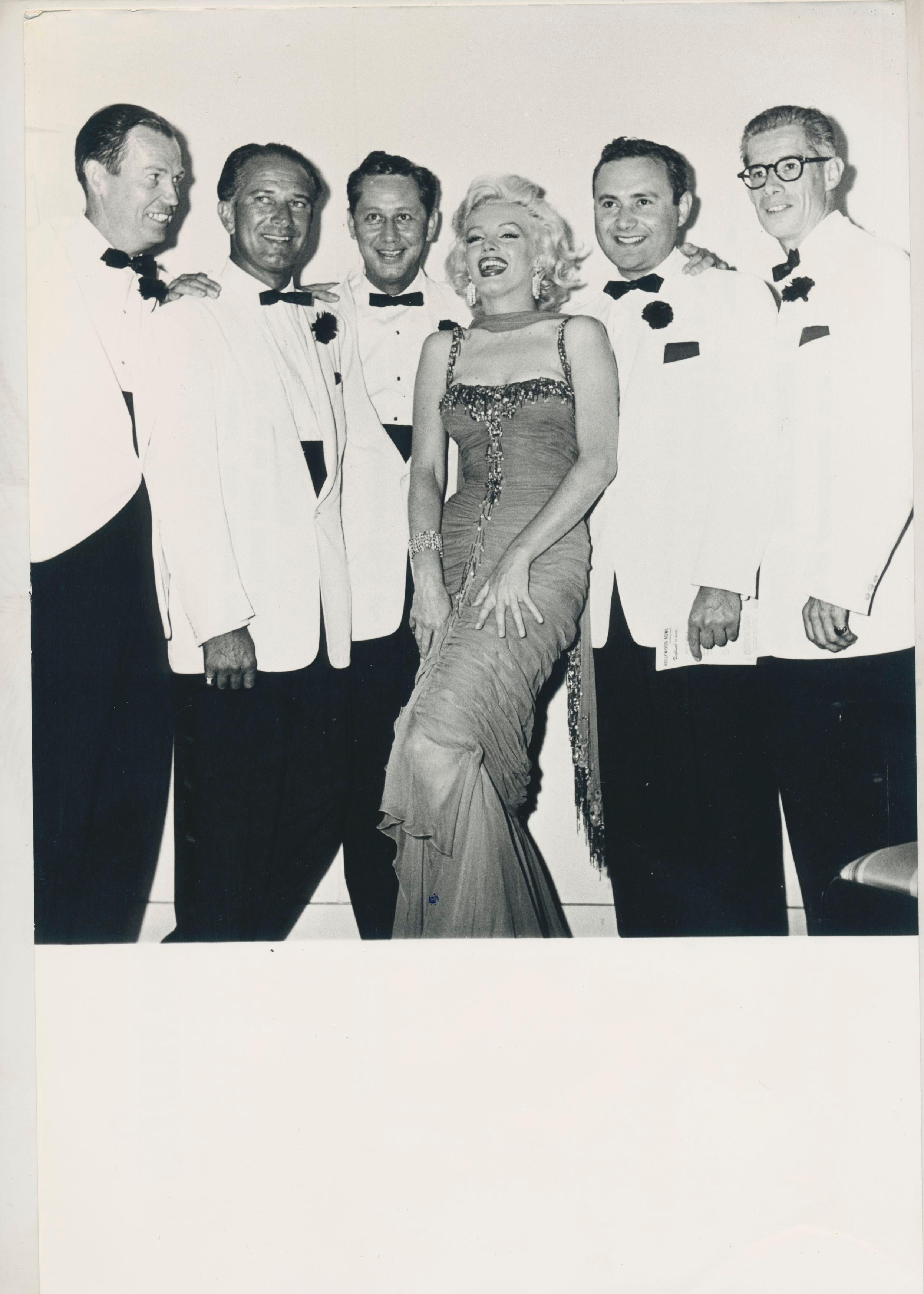 Unknown Black and White Photograph - Marilyn Monroe with Anncouncers of the KLAC Radio station, Hollywood Blvd., 1953