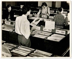 Old Days - Selecting Vinyls.- Vintage photo - 1960s