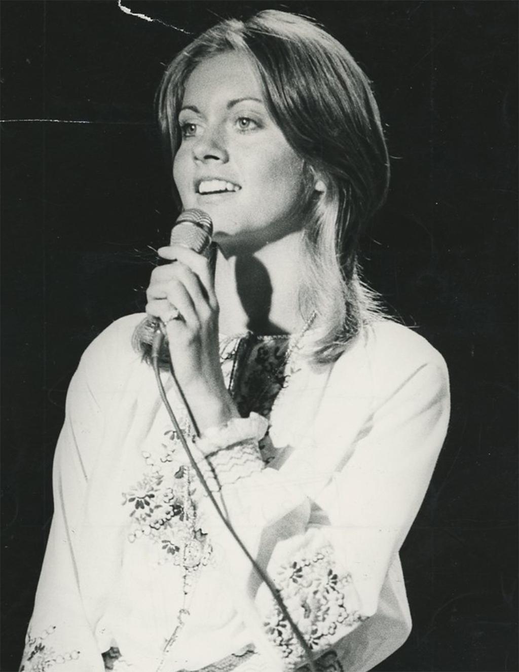 Olivia Newton John Portrait of her Singing in 1972  - Photograph by Unknown