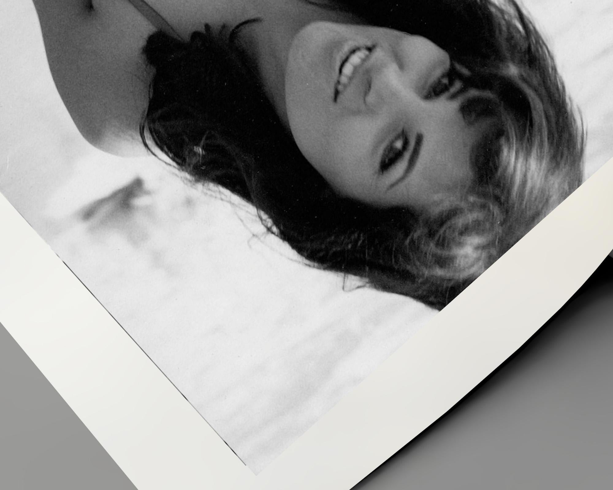 Raquel Welch Posed on Beach - Gray Black and White Photograph by Unknown