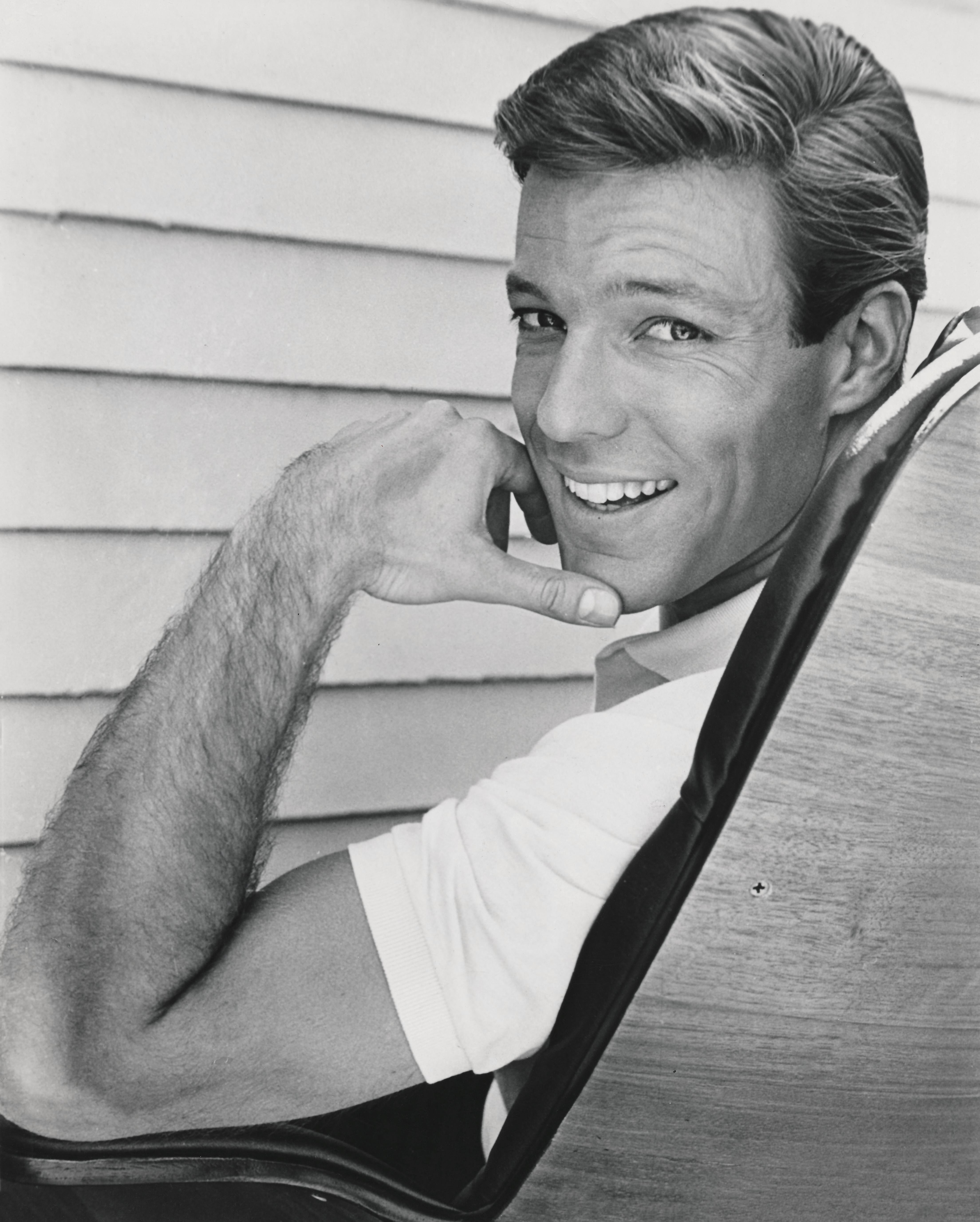 Unknown Black and White Photograph - Richard Chamberlain Smiling in Chair Fine Art Print