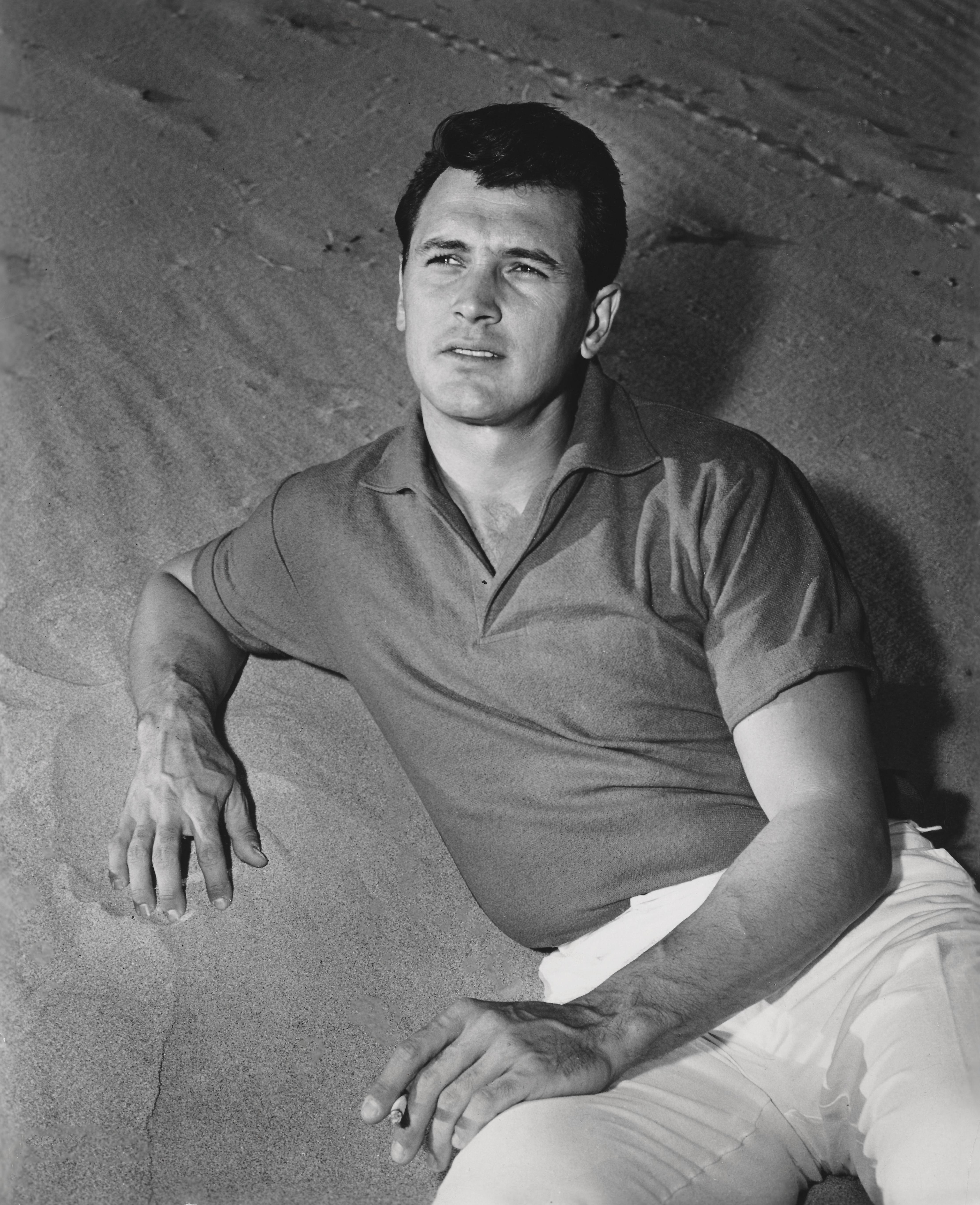 Unknown Black and White Photograph - Rock Hudson Lying in Sand Globe Photos Fine Art Print