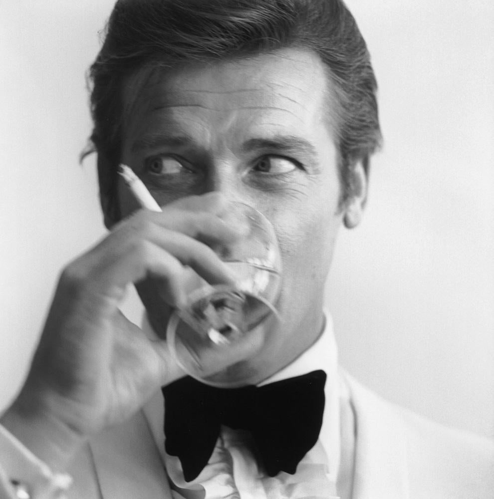 Black and White Photograph de Unknown - Shaken not Stirred, 1968 - 007 James Bond Roger Moore Portrait Tuxedo Martini