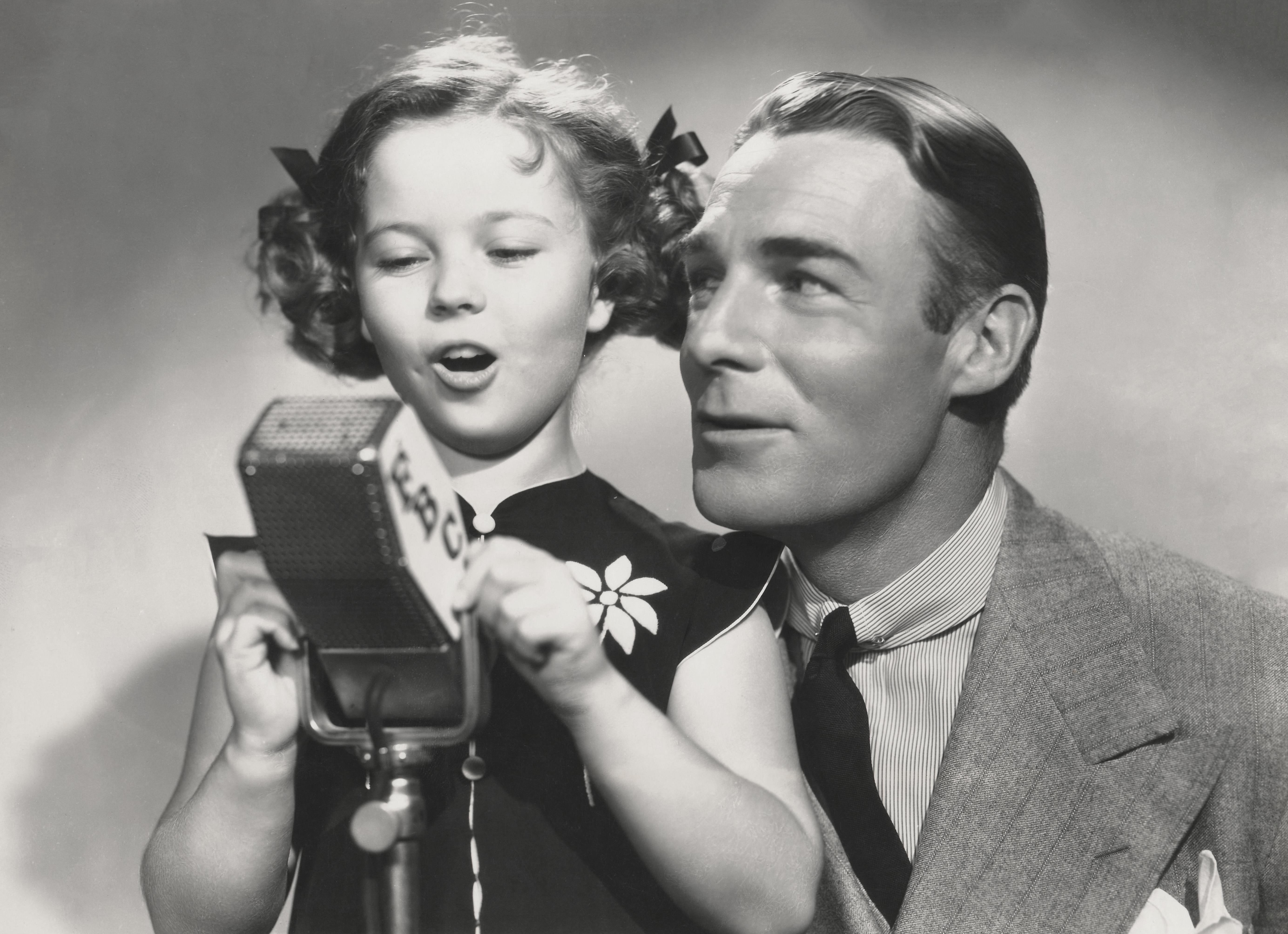 Unknown Black and White Photograph - Shirley Temple Singing with Jack Haley Fine Art Print