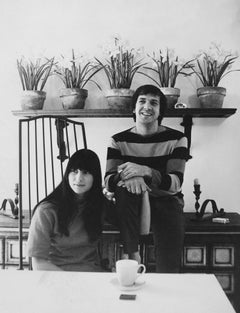 Retro Sonny and Cher Smiling in Kitchen