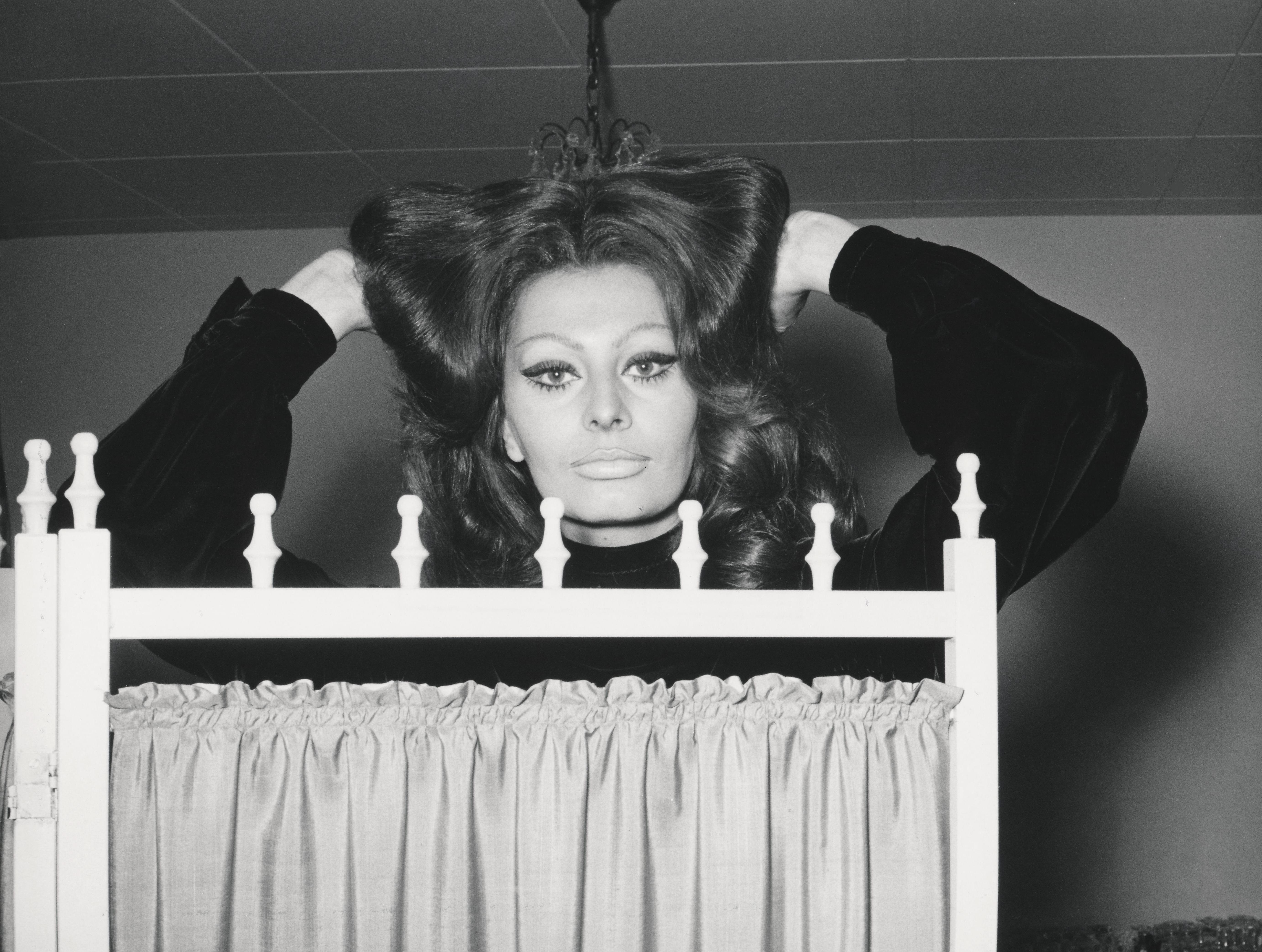 Unknown Portrait Photograph - Sophia Loren Behind Folding Screen Fine Art Print