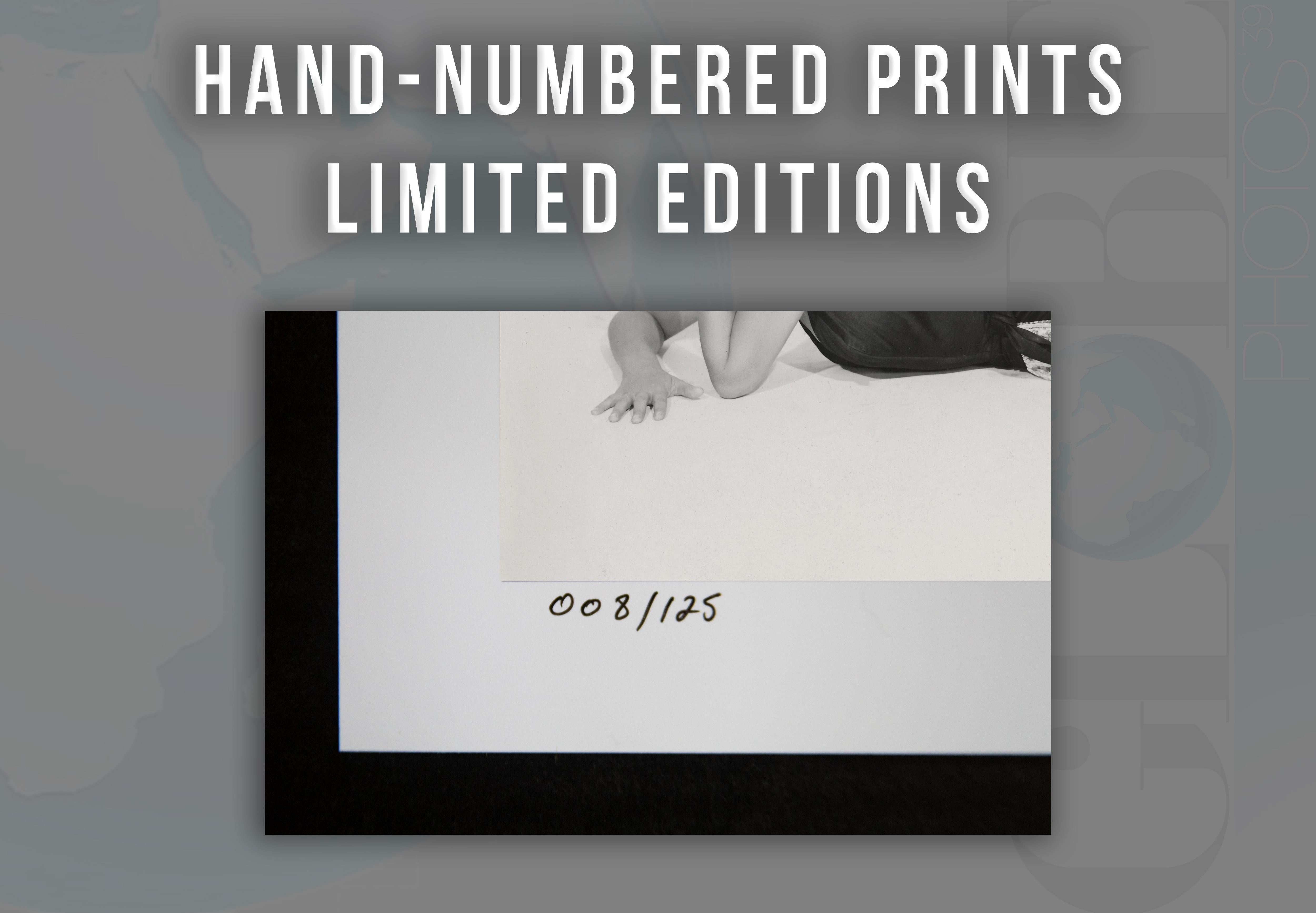 This pinup studio portrait features star Sophia Loren lying on the floor, leg revealed through a large slit in her skirt.

Known for her roles in films such as 