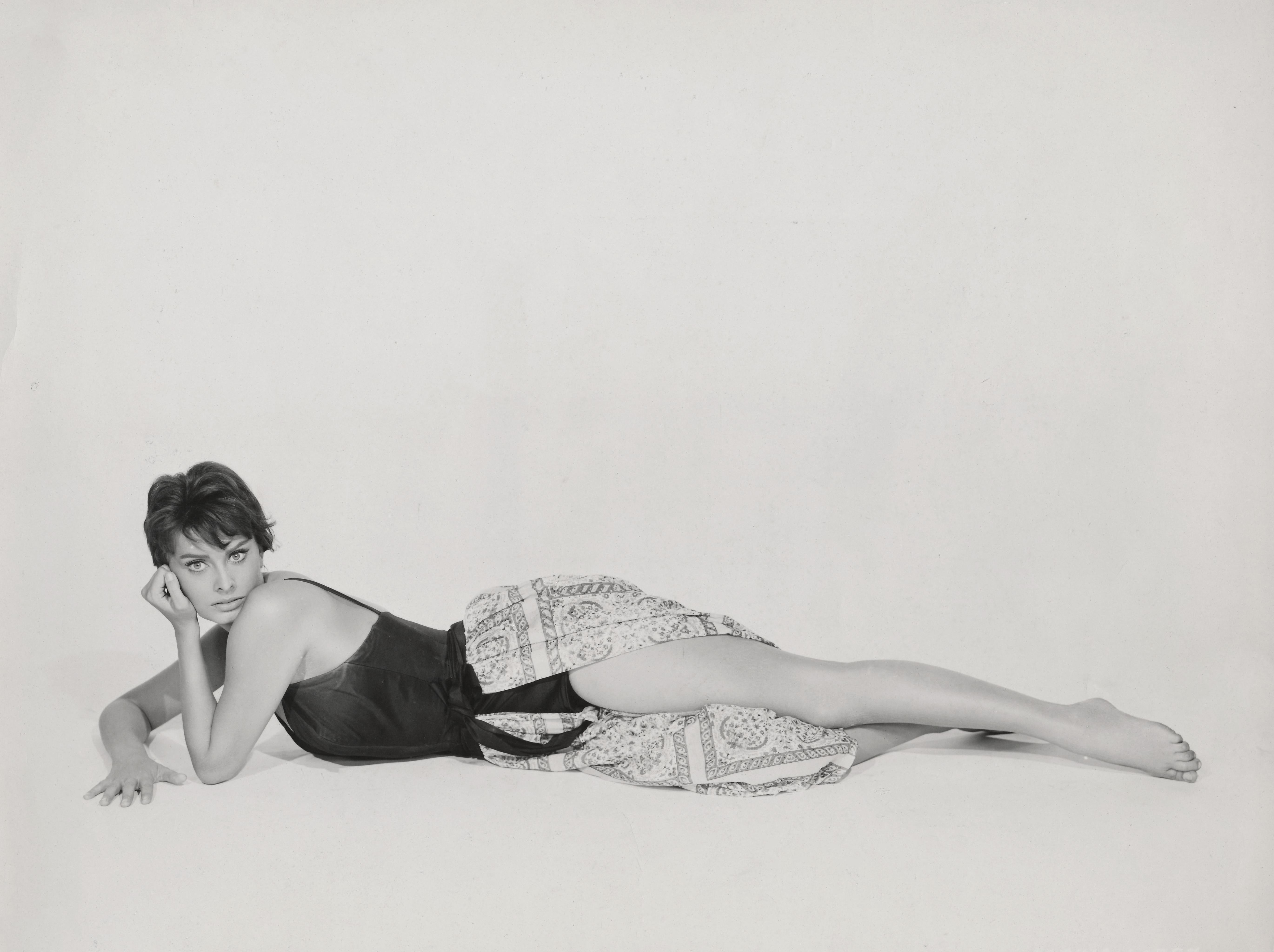 Unknown Black and White Photograph - Sophia Loren Lying in Pinup Pose Fine Art Print