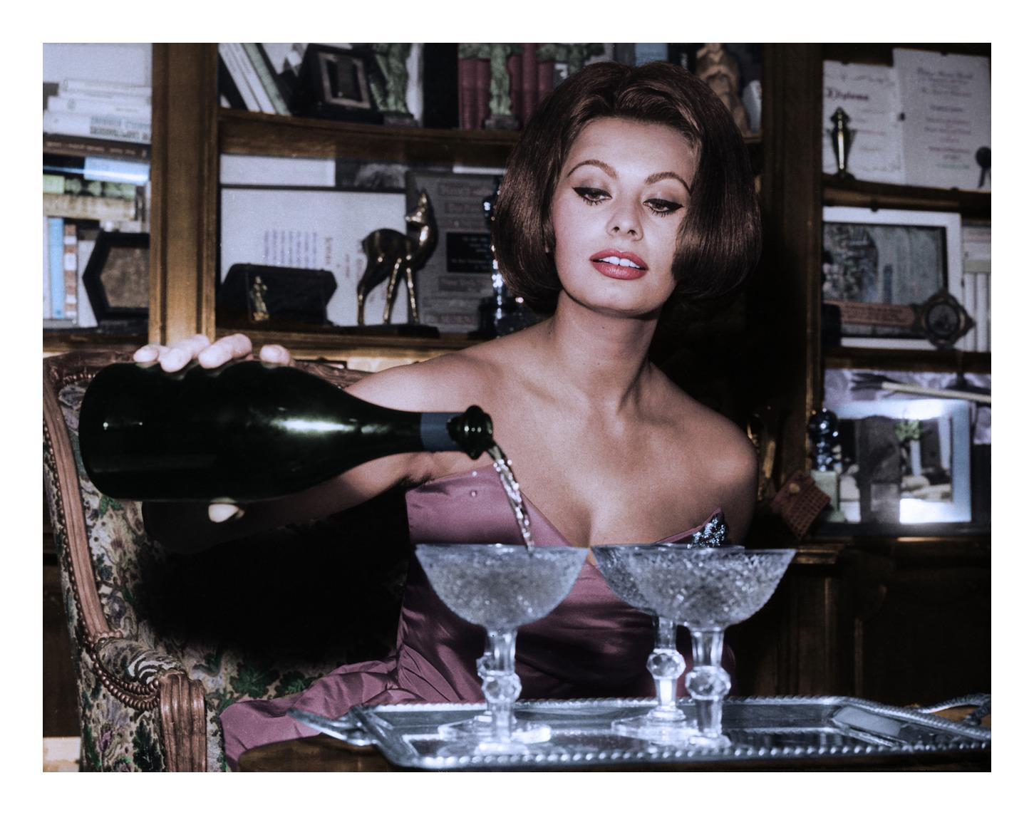Sophia Loren Pouring Champagne - Photograph by Unknown