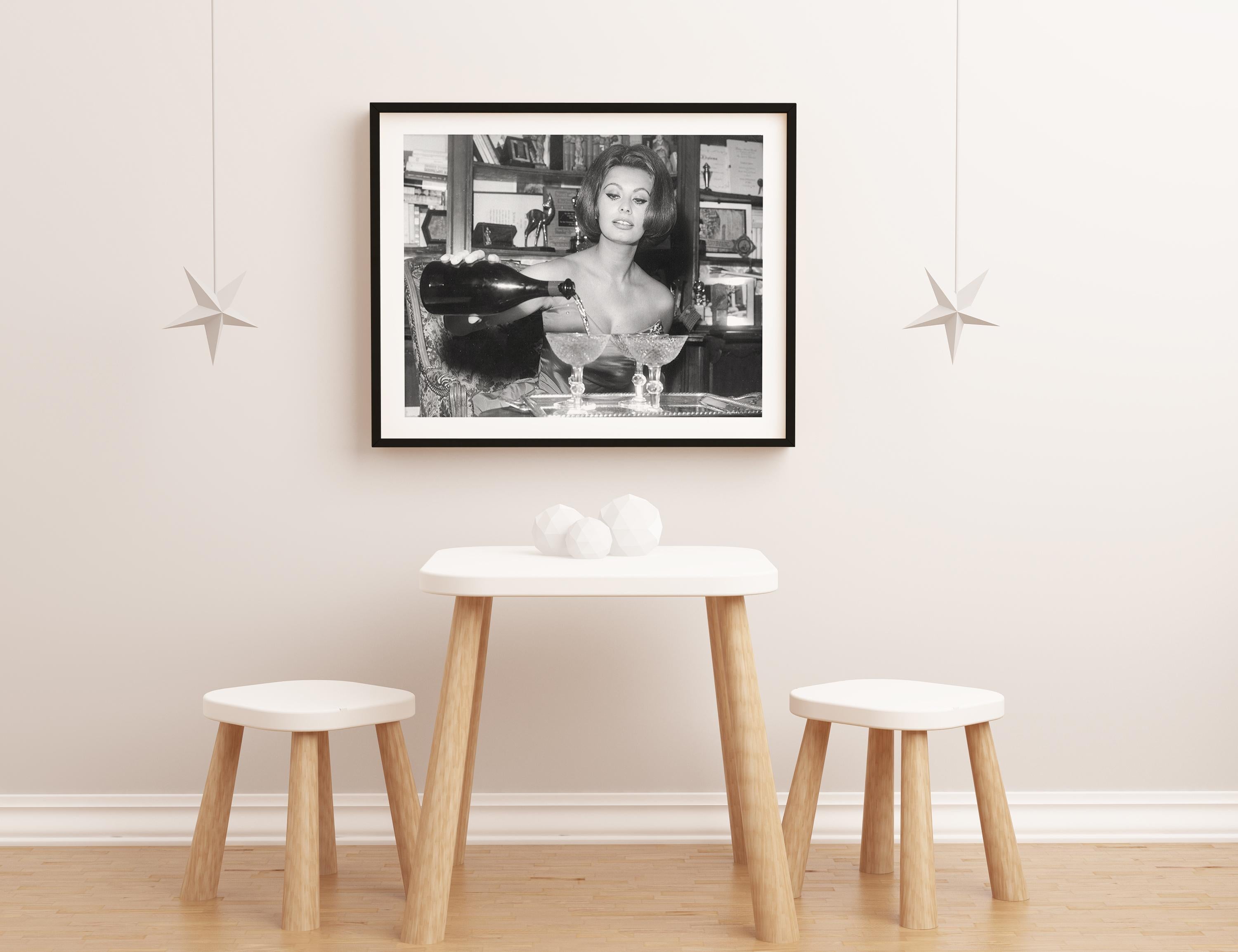Sophia Loren Pouring Champagne on New Year's Eve Globe Photos Fine Art Print For Sale 1