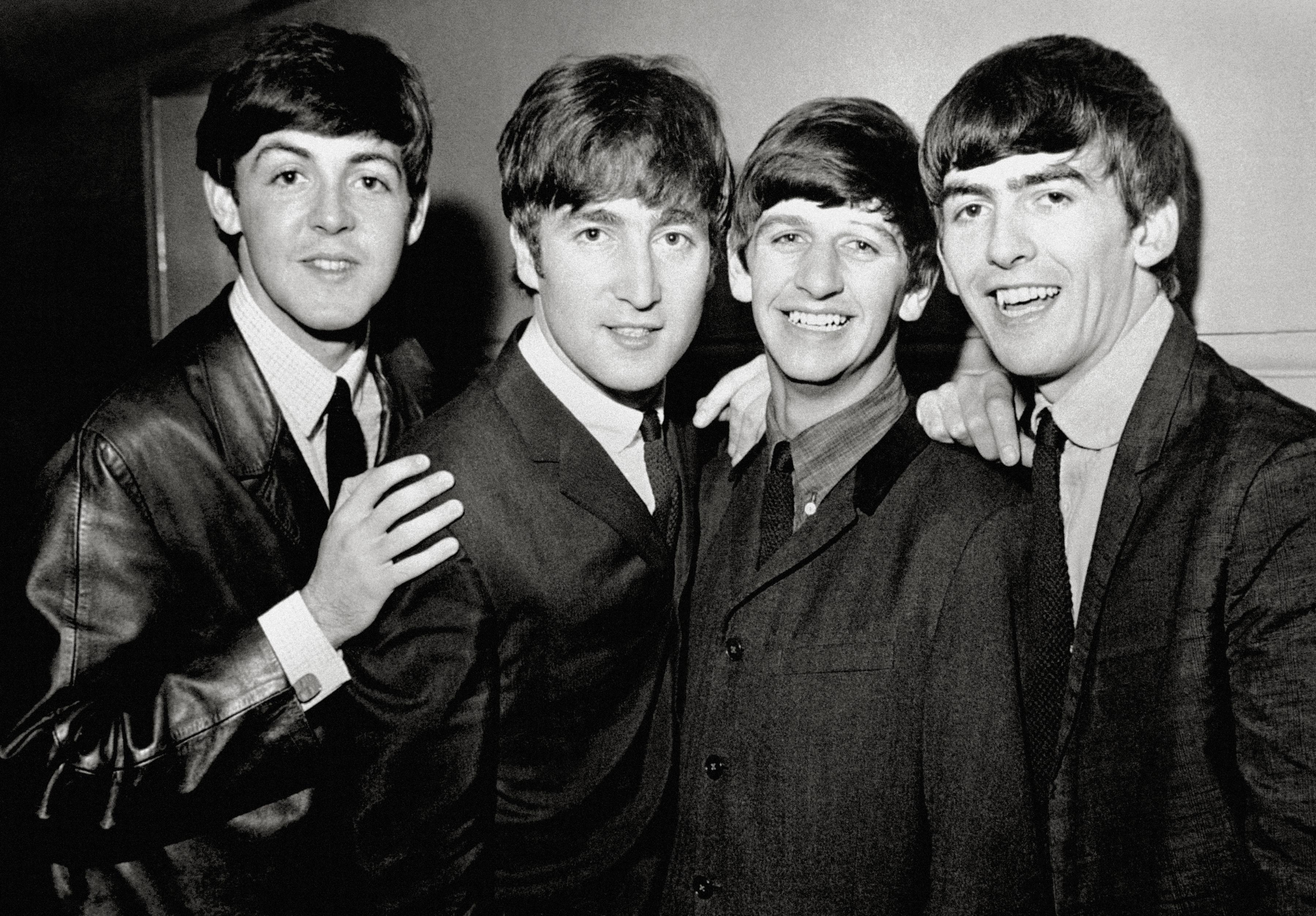 Unknown Black and White Photograph - The Beatles Posed Smiling Globe Photos Fine Art Print