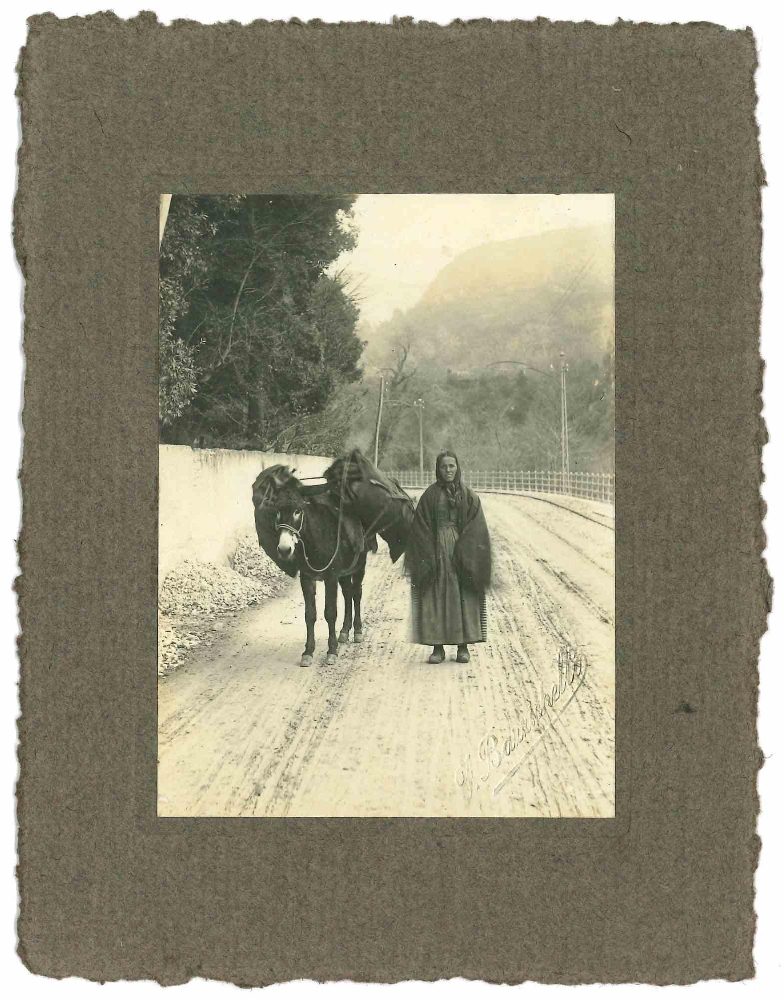 Unknown Figurative Photograph - The Old Days - Woman on the Snowy Road - Early 20th Century