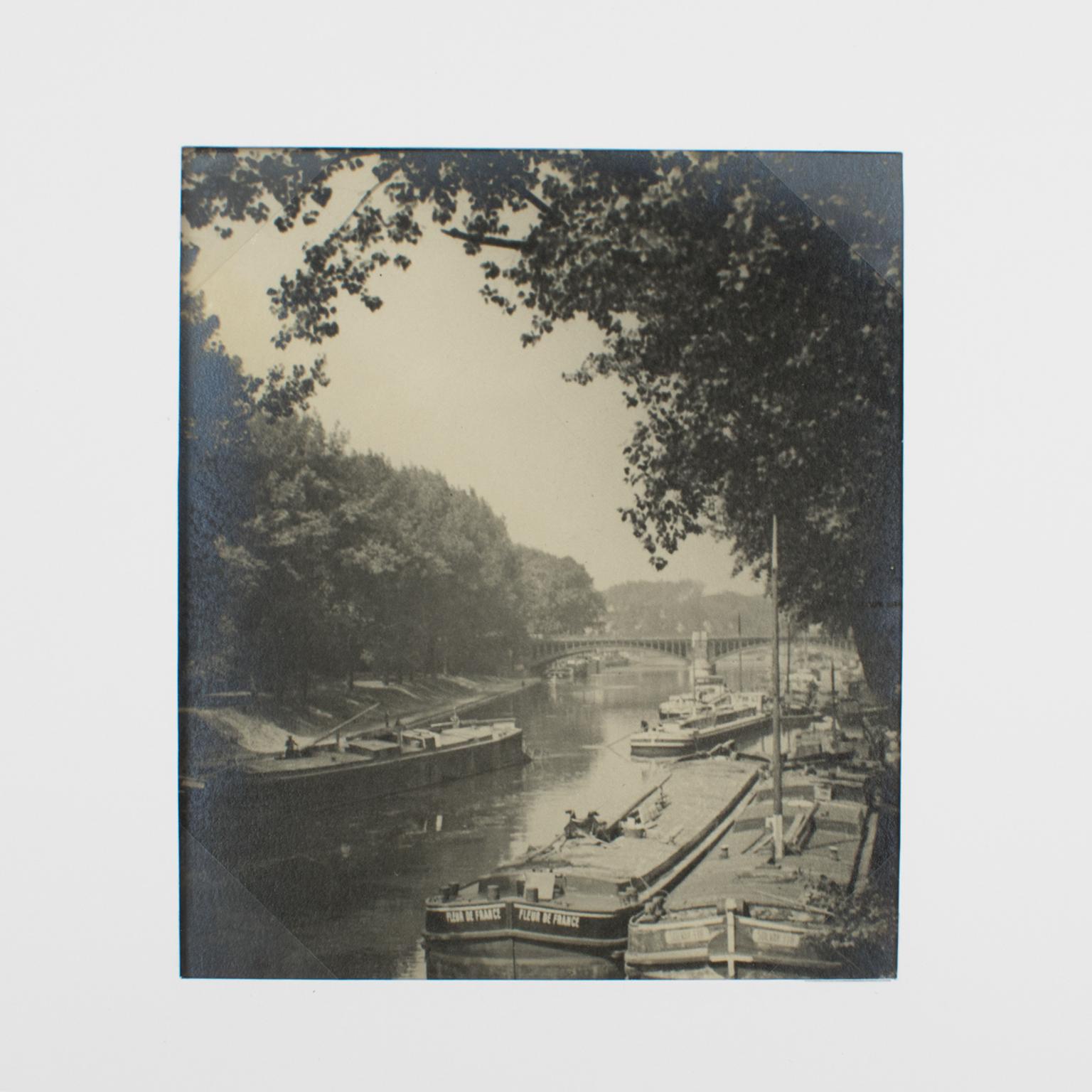 A unique original silver gelatin black and white photograph. View of Charenton le Pont, east suburb of Paris, France, June 1926. 
This original photograph shows a view of the canal with its barge boats in Charenton le Pont, an east suburb of Paris,
