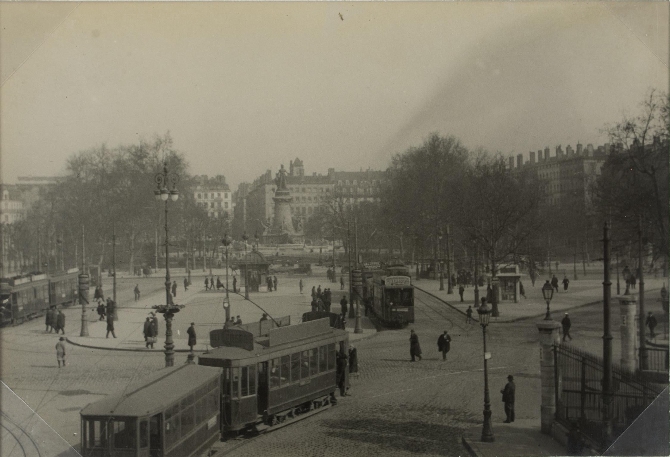 A unique original silver gelatin black and white photograph. The tramway lines on a large place in Lyon, France, circa 1930. 
The center of Lyon was already very well served by many modern tramway lines in 1930.
Features:
Original Silver Gelatin