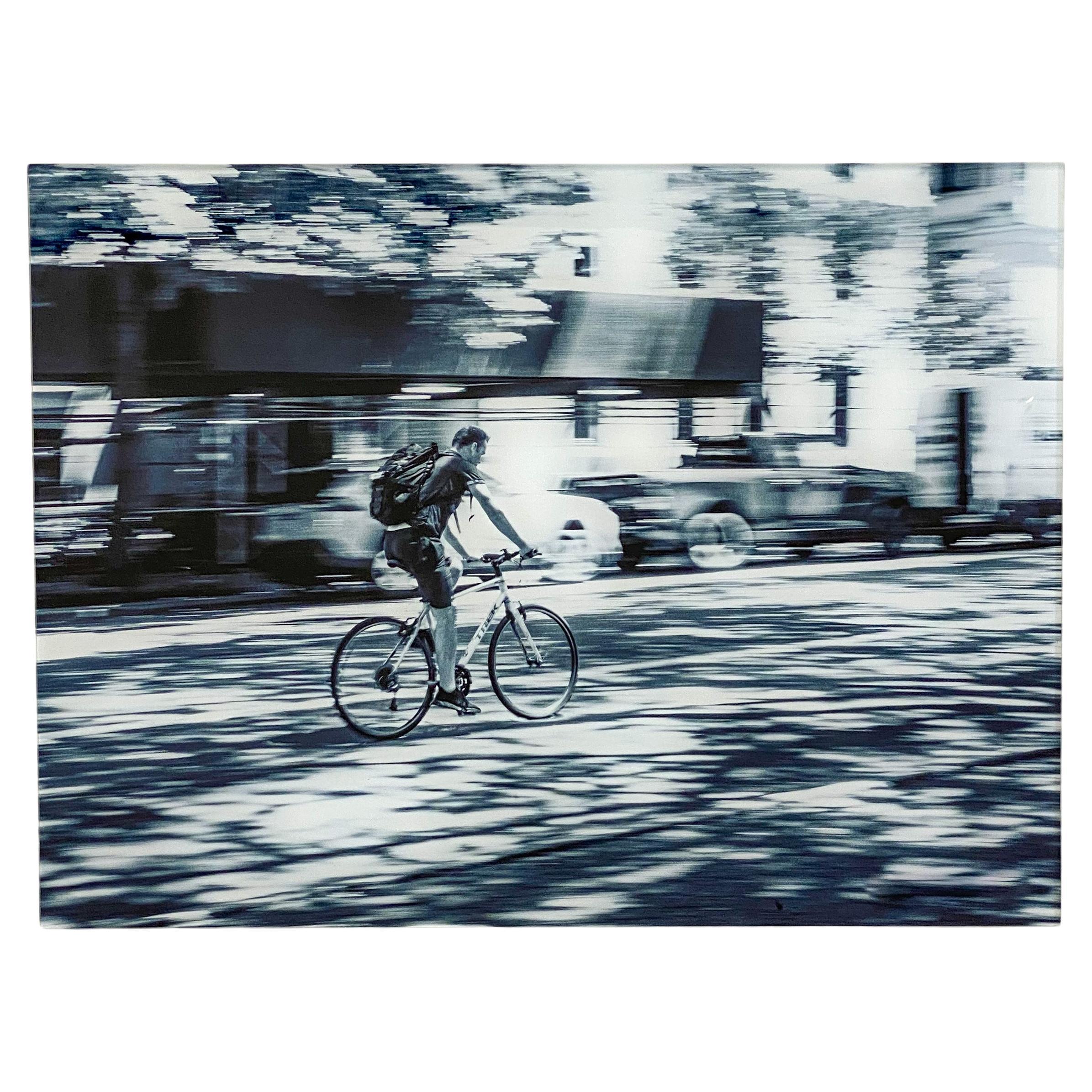 A beautiful urban expressionist photography in black and white of a man riding his bicycle in New York City entitled " Hermes " on plexiglass by the contemporary artist Marc Vandermeer ( American, 1950's). 
COA available upon request. 
Dimensions: