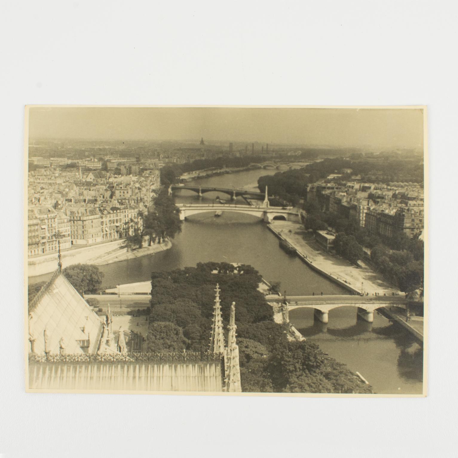 A unique original silver gelatin black and white photograph. A view of Paris and the River Seine from the Notre Dame Cathedral, circa 1950.
Features:
Original Silver Gelatin Print Photography Unframed.
Press Photography.
Press Agency: