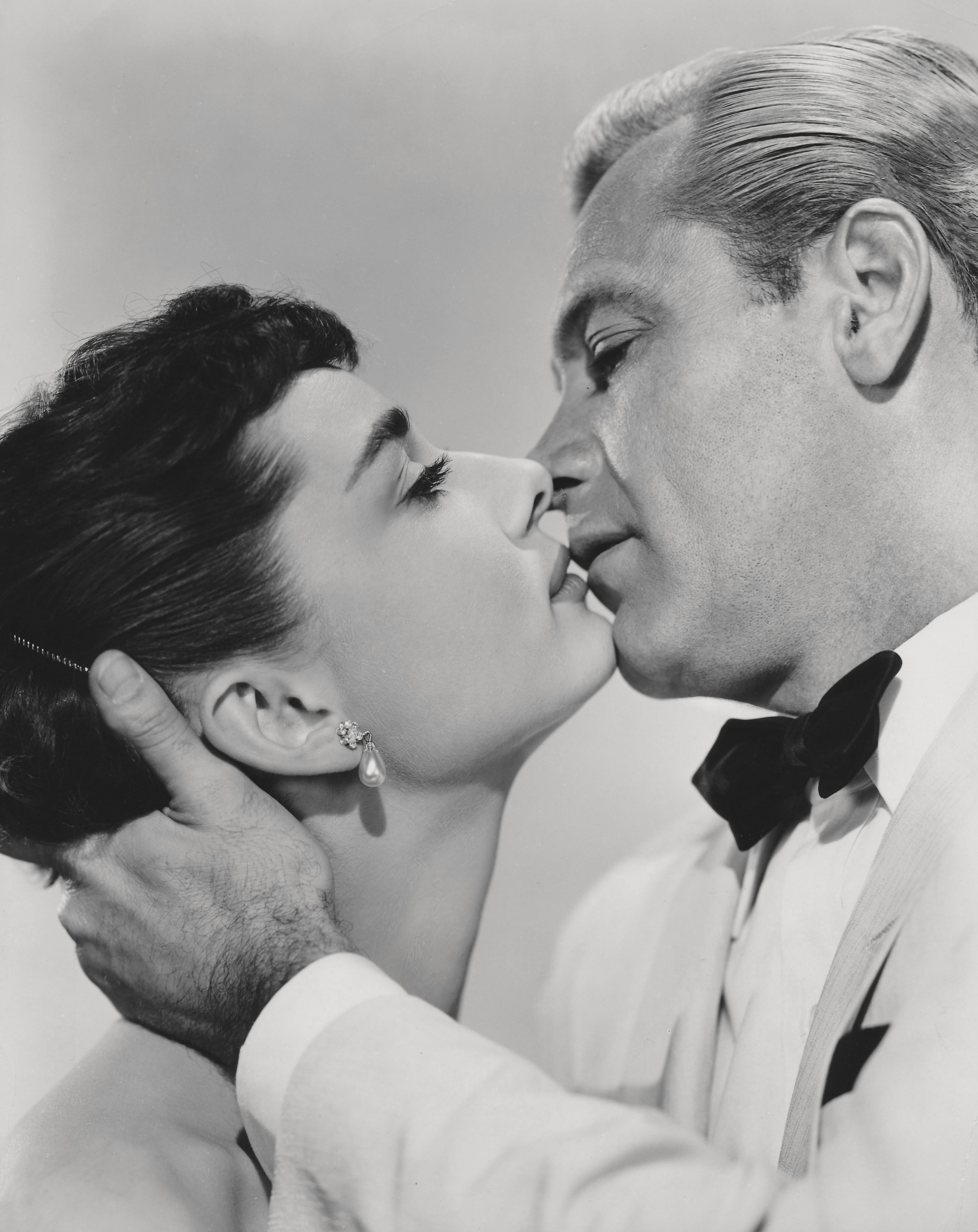 Unknown Portrait Photograph - William Holden and Audrey Hepburn Iconic Kiss Fine Art Print