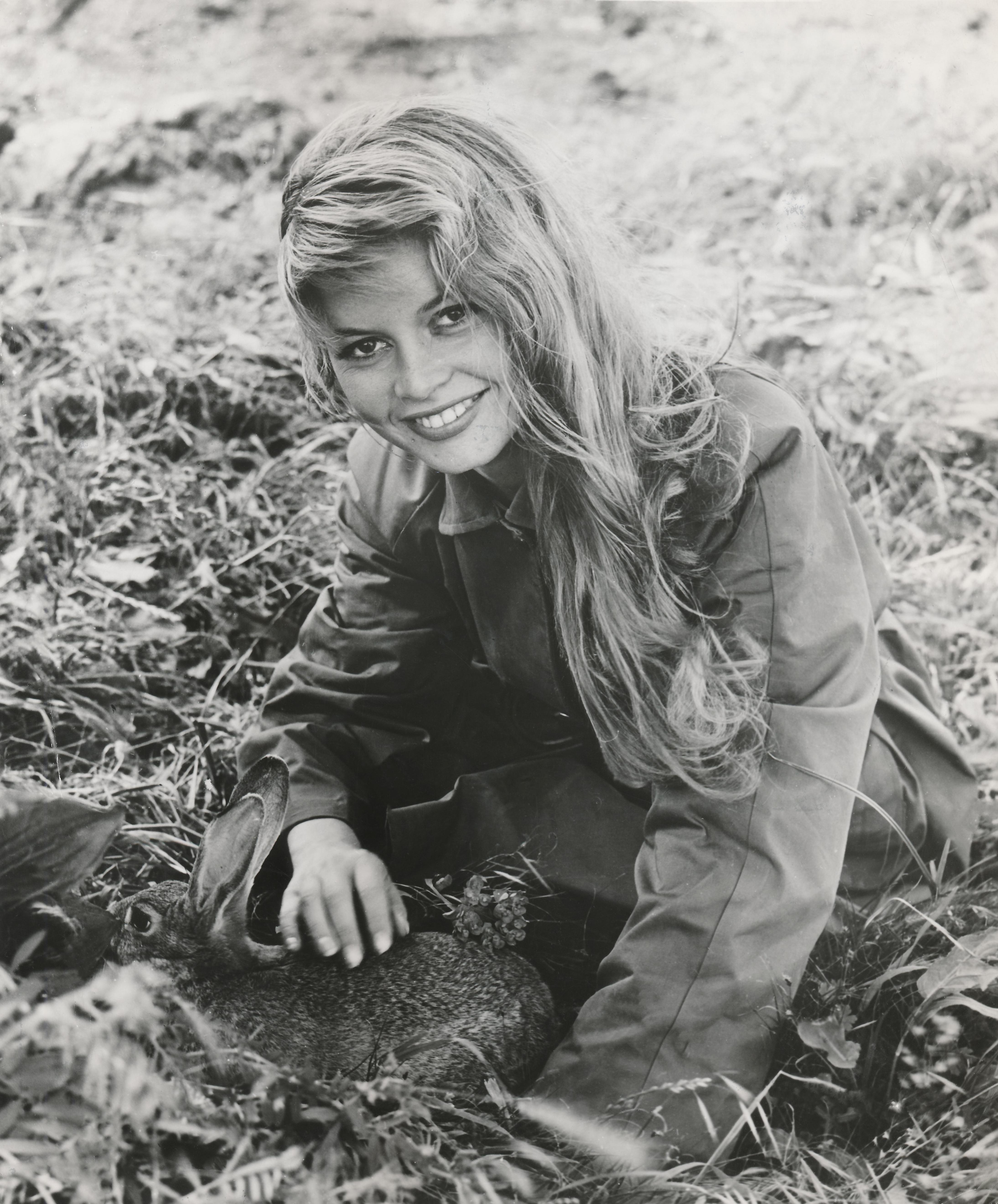 Unknown Black and White Photograph - Young Brigitte Bardot Smiling in the Grass Fine Art Print