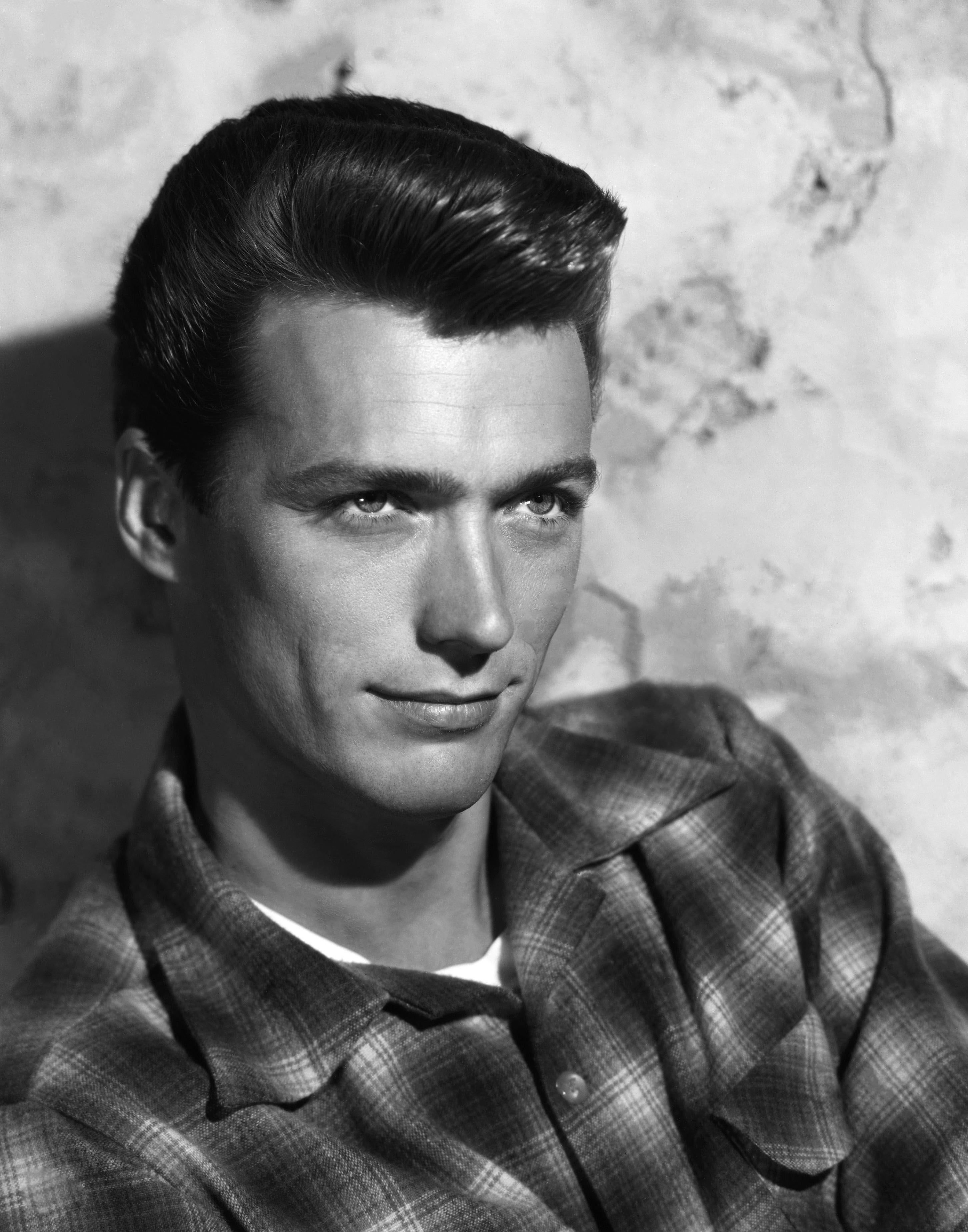 Unknown Black and White Photograph - Young Clint Eastwood Looking Up Globe Photos Fine Art Print