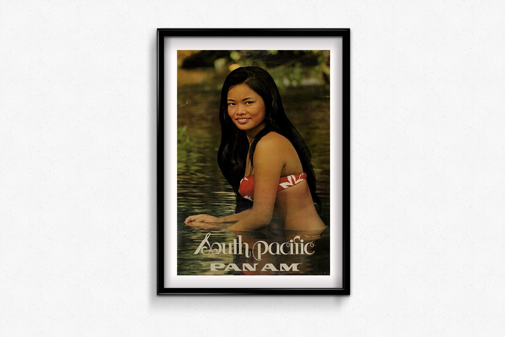 This stunning 1960s travel poster by Pan American World Airways (Pan Am) perfectly encapsulates the romantic allure of the South Pacific, a dream destination for jet-age travelers. Featuring a young Polynesian woman immersed in tranquil waters, the