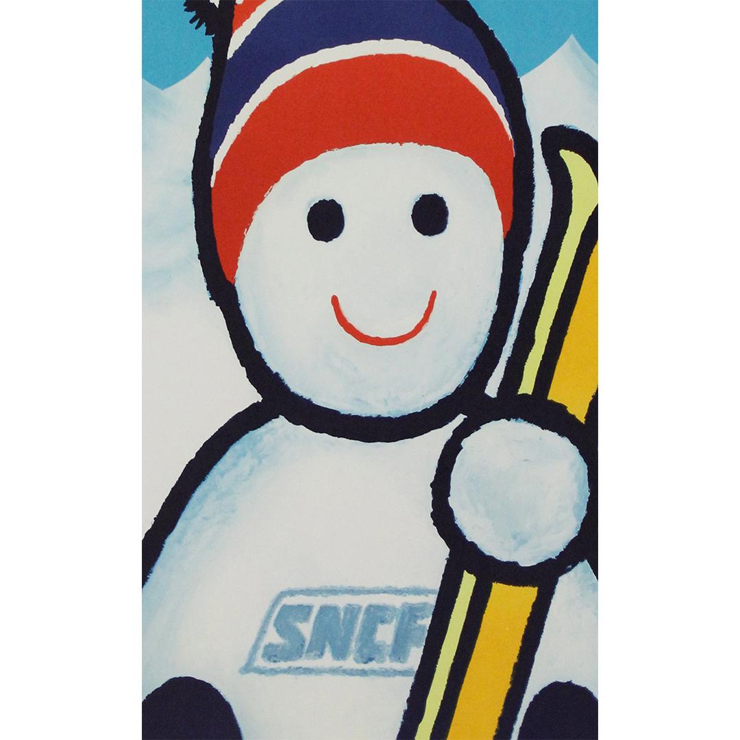 In this delightful 1975 promotional poster, the SNCF (French National Railways) captures the charm and efficiency of train travel for winter sports holidays. Featuring an irresistibly cheerful snowman holding a pair of yellow skis and wearing a snug