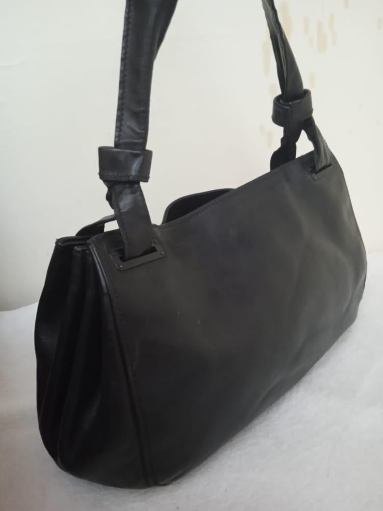 Gucci black leather bag vintage  - Print by Unknown
