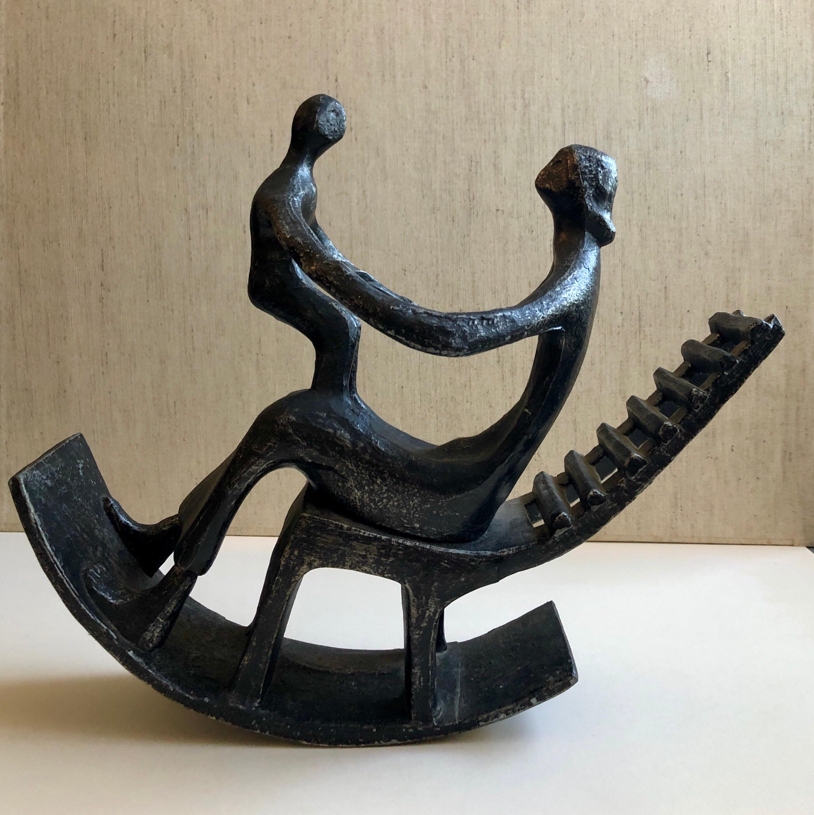 In the style of Henry Moore, Mother and Child in Rocking Chair 