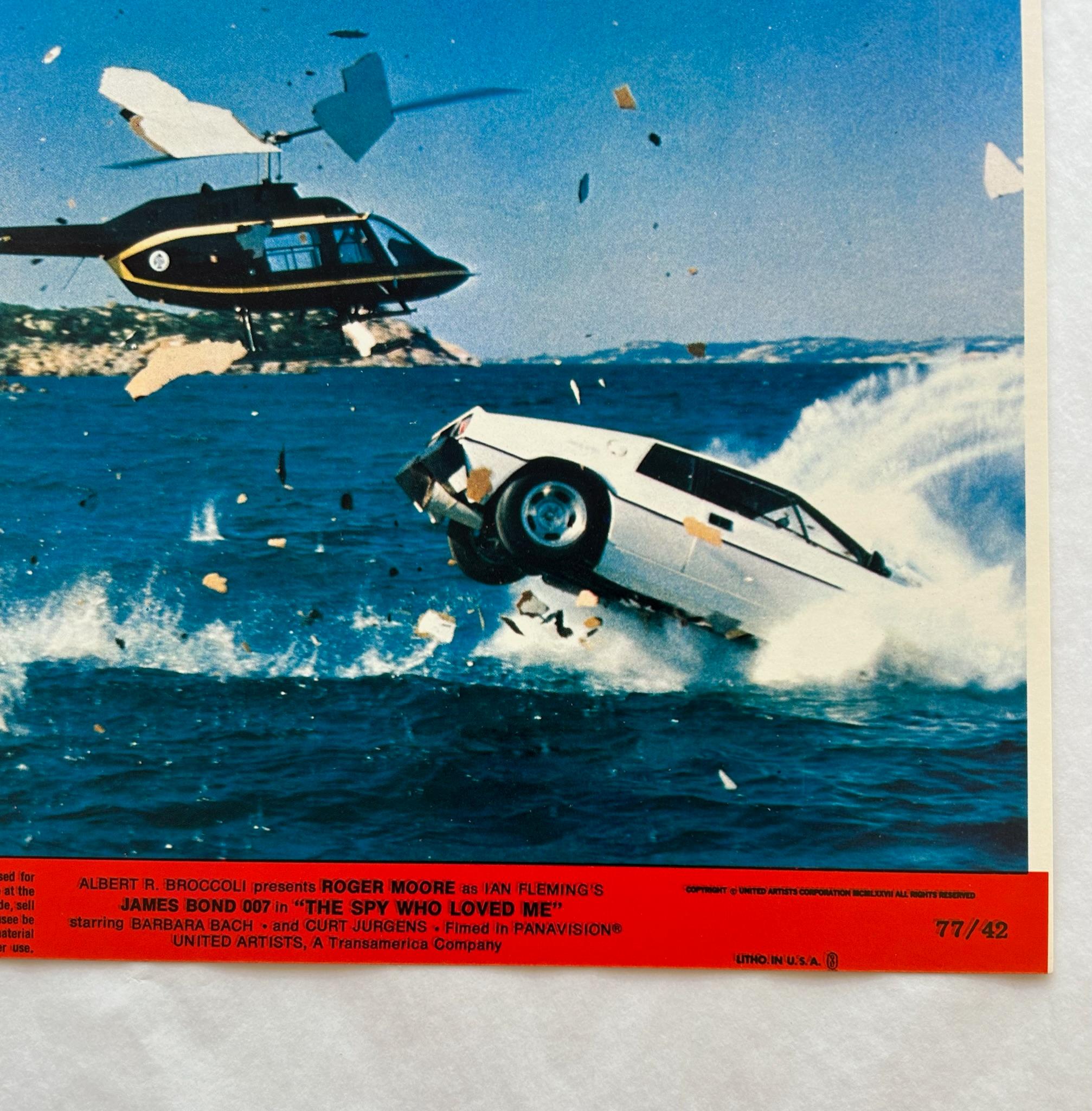 James Bond The Spy Who Loved me - Original 1977 Lobby Card #7

Vintage 1977 The Spy Who Loved Me lobby card of 007's car crashing into the water with a helicopter in pursuit 

Framing options available: Black, brown, white and perspex 

Condition: