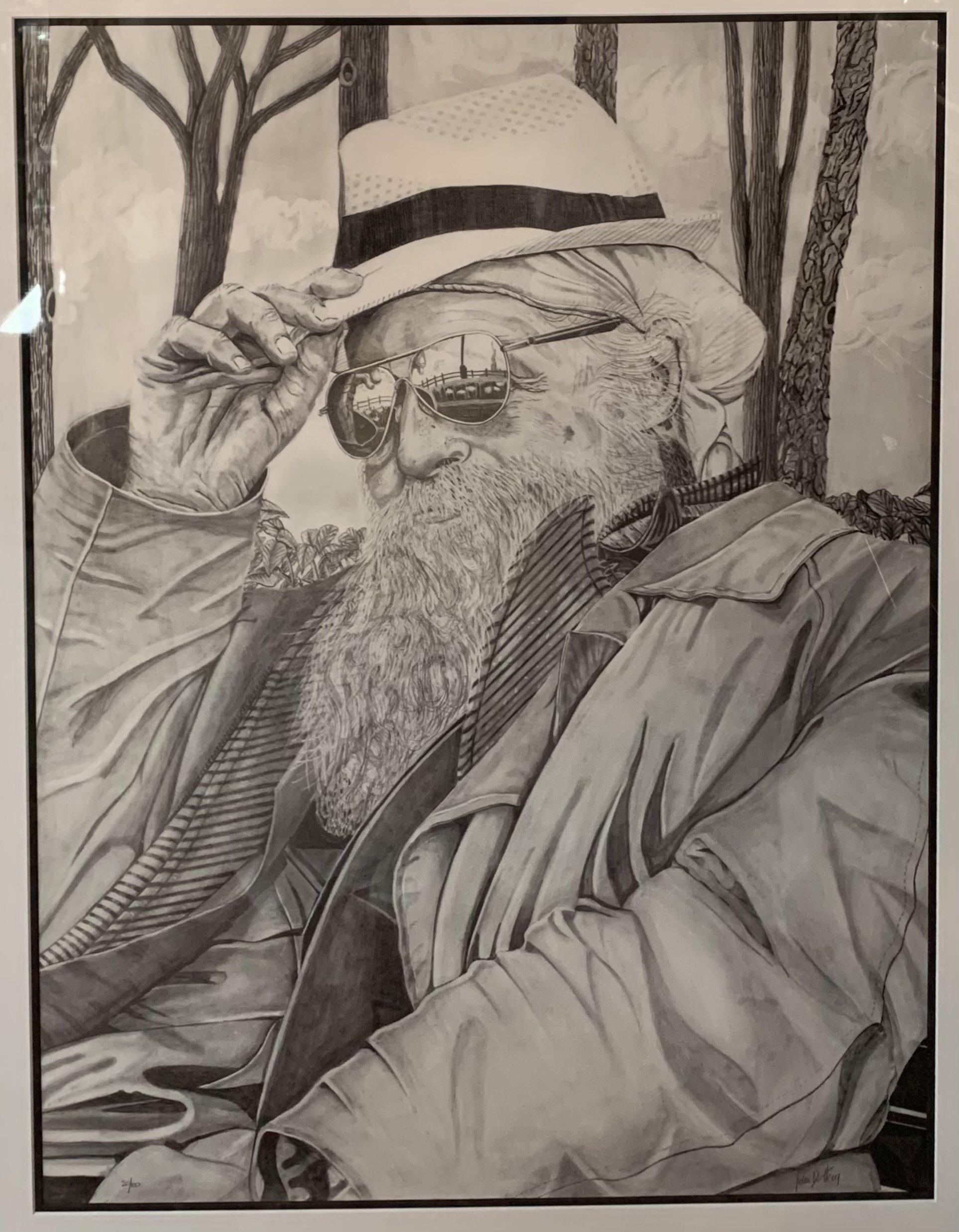 Ein großer Porträtdruck eines Mannes mit Hut und Brille, der in einem Park sitzt, mit dem Titel 
