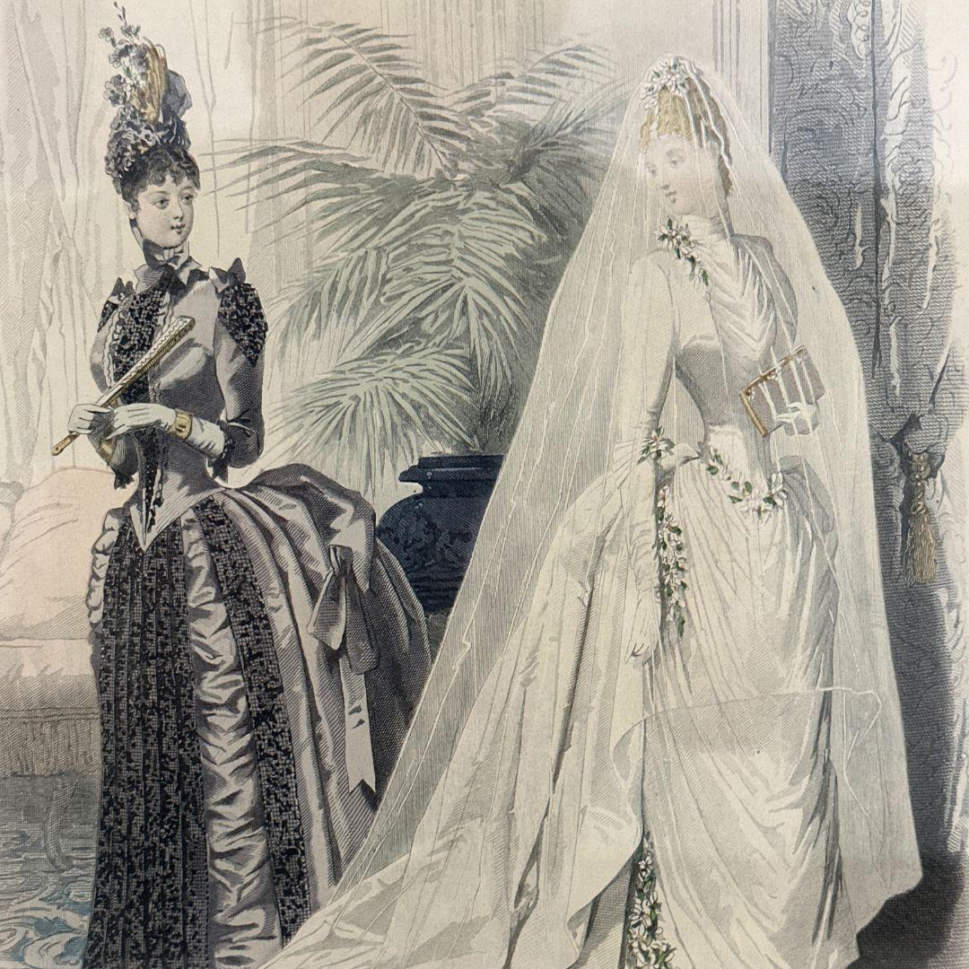 Transport yourself to the elegance of Victorian French fashion with this vintage lithograph print featuring exquisite ladies' La Mode dresses. The unframed size of the print measures 13.5