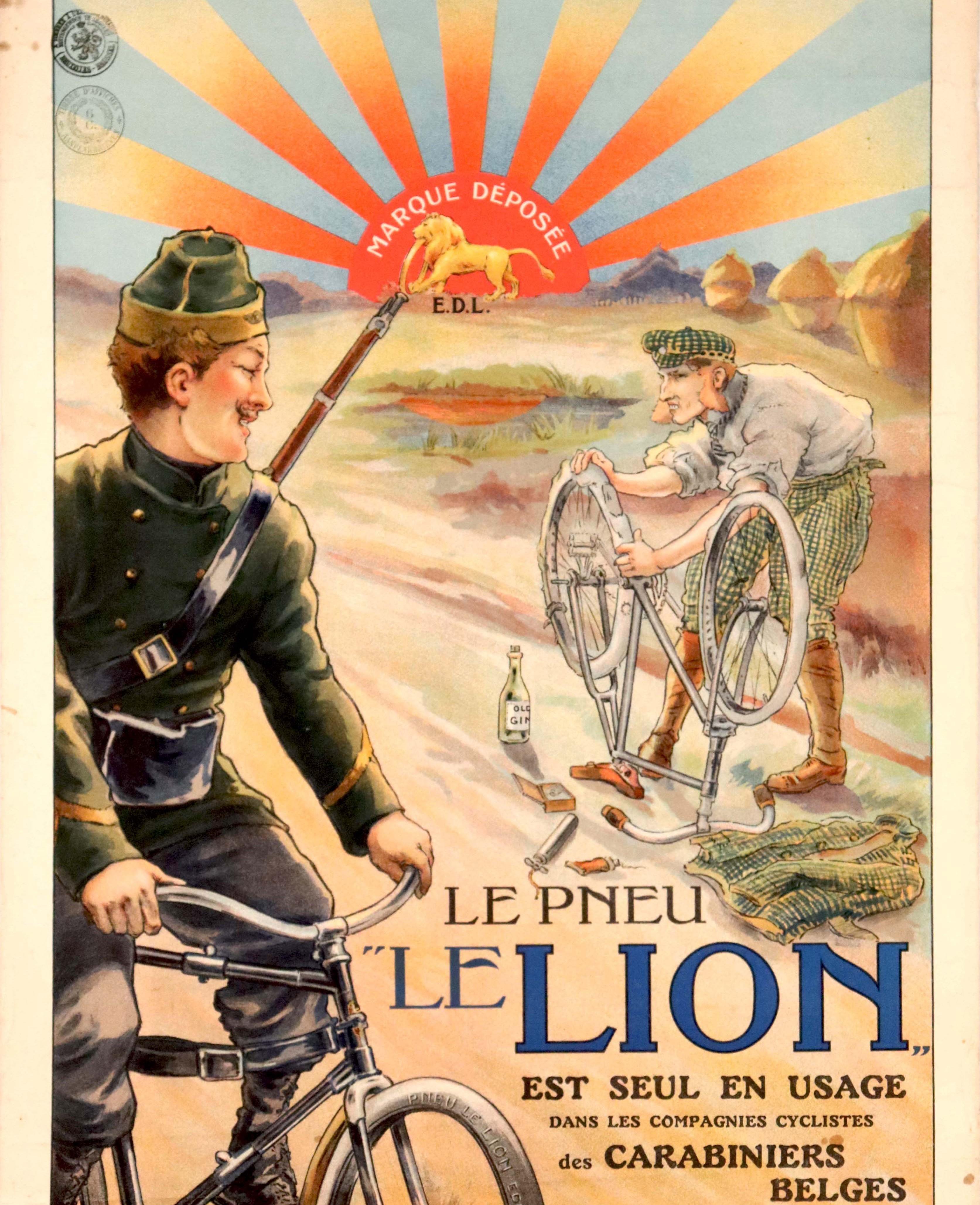 Original antique advertising poster for Le Lion tyres featuring an illustration of a smiling Belgian carabinier soldier with a rifle gun over his shoulder riding a bicycle past a man mending a flat tyre on his bike on the side of a countryside path,