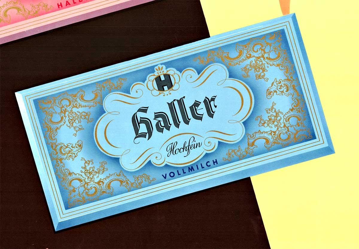 Cartel publicitario alemán original vintage de los años 50 de las tabletas de chocolate Haller - Una obra maestra del coleccionismo retro.  Con soporte de lino de archivo profesional, en excelente estado y listo para enmarcar.   Se trata de un