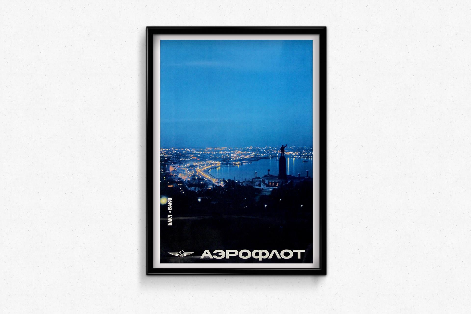 This evocative original Soviet travel poster by Aeroflot, the USSR’s national airline, captures the serene grandeur of Baku, capital of Soviet Azerbaijan, as night falls over the Caspian Sea. Bathed in cool blue twilight, the city’s lights begin to