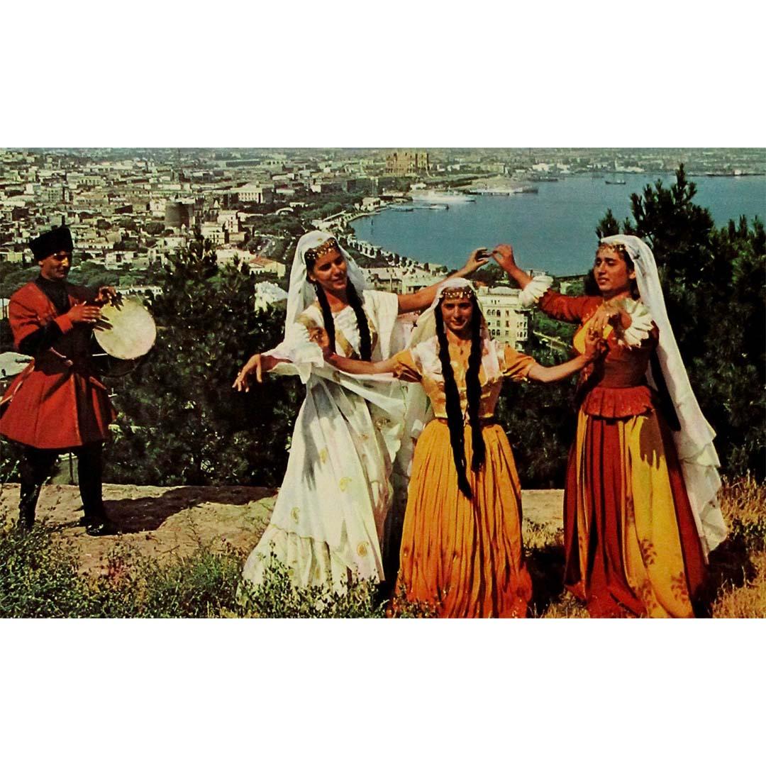 This vibrant original Soviet travel poster, issued by Intourist, the USSR’s official tourism agency, invites French-speaking travelers to discover Baku, the dynamic capital of Soviet Azerbaijan. Radiating the spirit of cultural pride and unity, the