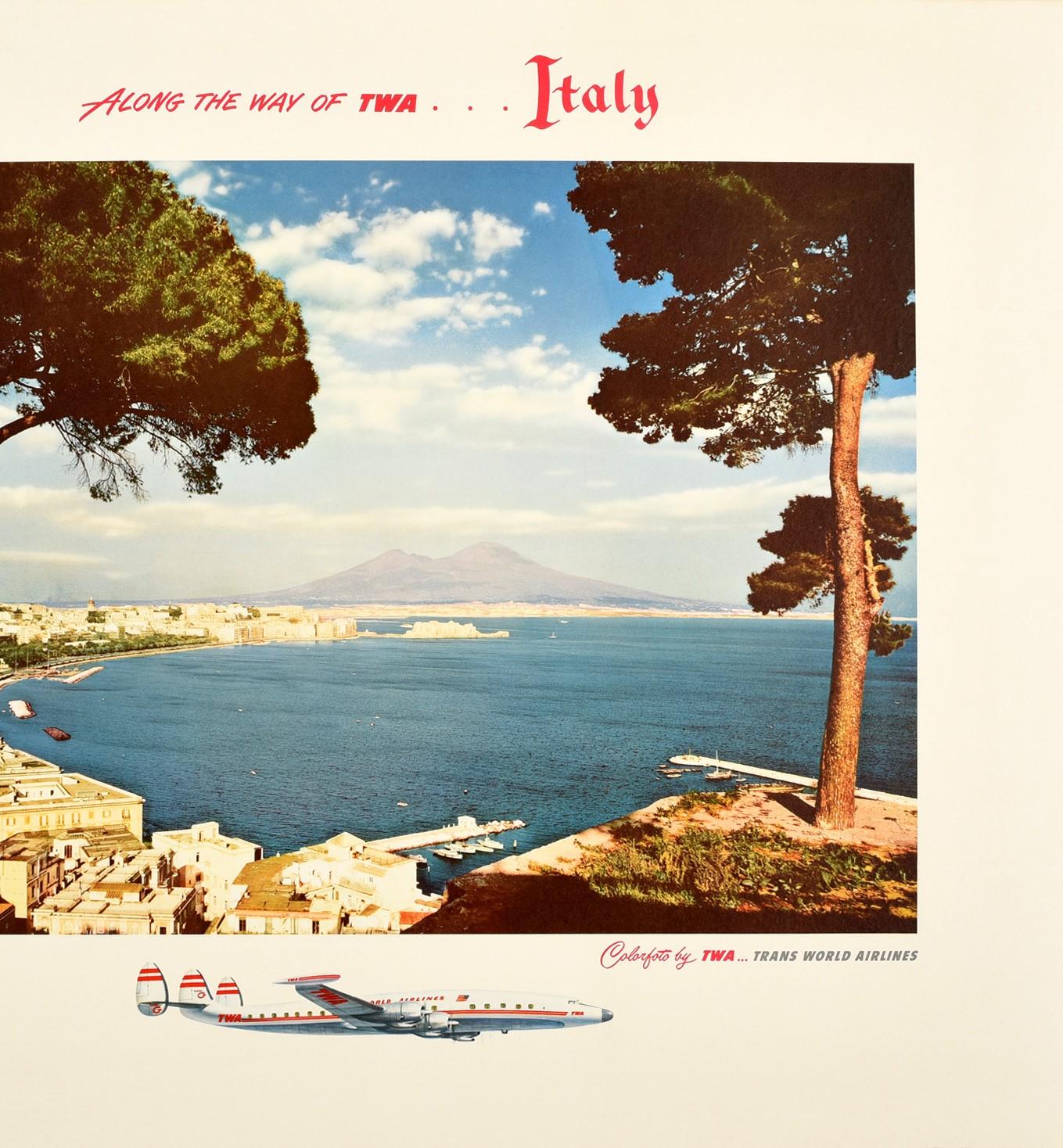 Original vintage travel advertising poster - Along the way of TWA ... Italy The Bay of Naples Trans World Airlines - featuring a view over the Gulf of Naples towards Mount Vesuvius with the town along the peninsula, boats in the harbour on the calm