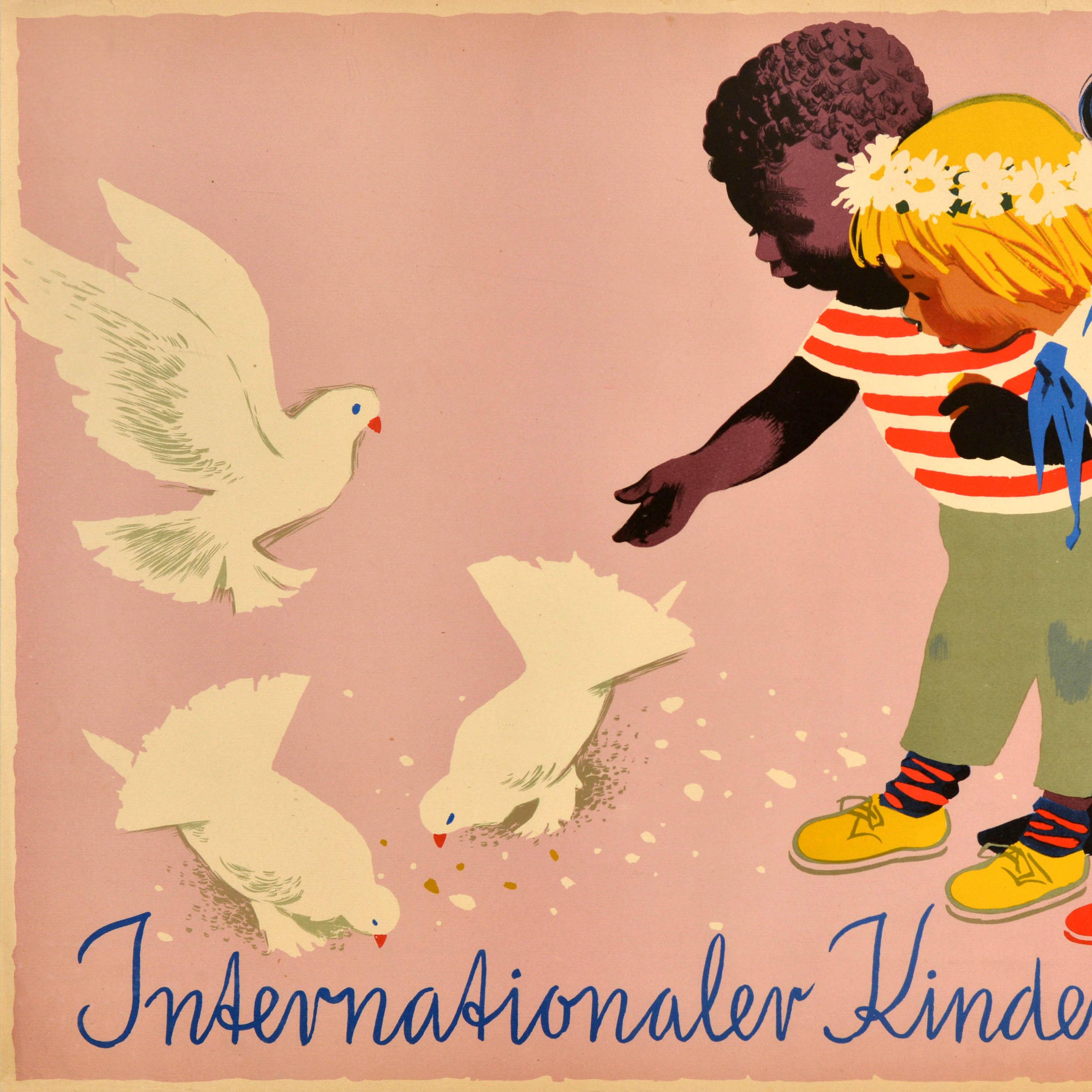 Original vintage poster for International Children's Day / Internationaler Kindertag 1959 featuring an illustration of three children from different nations feeding three white doves representing peace and watching them, one girl wearing a daisy