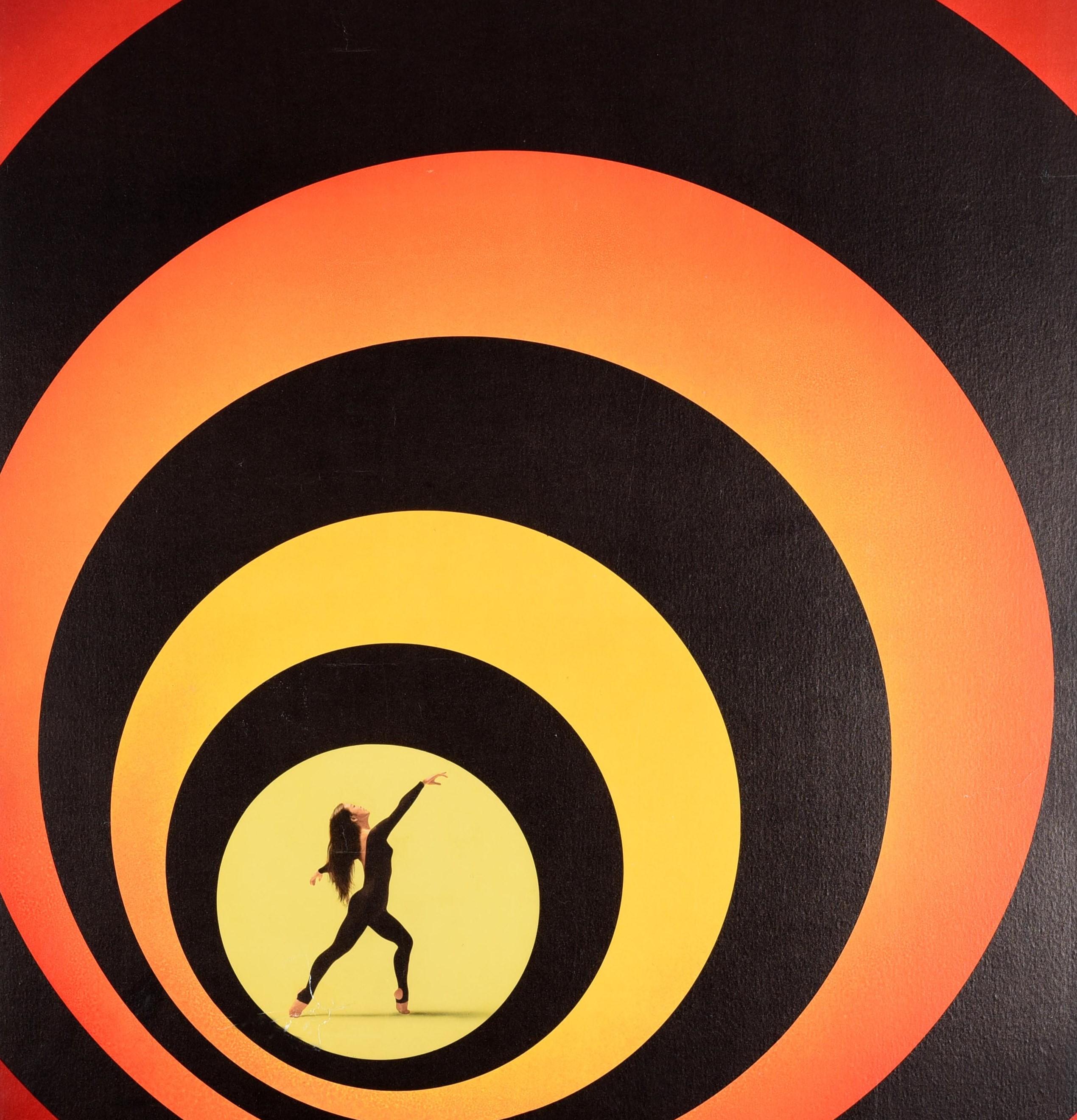Original vintage travel poster for Japan issued by Pan Am featuring a great graphic design showing a lady dancing in the centre of a James Bond style target formed by black circles against a yellow, orange and red shaded background with the stylised