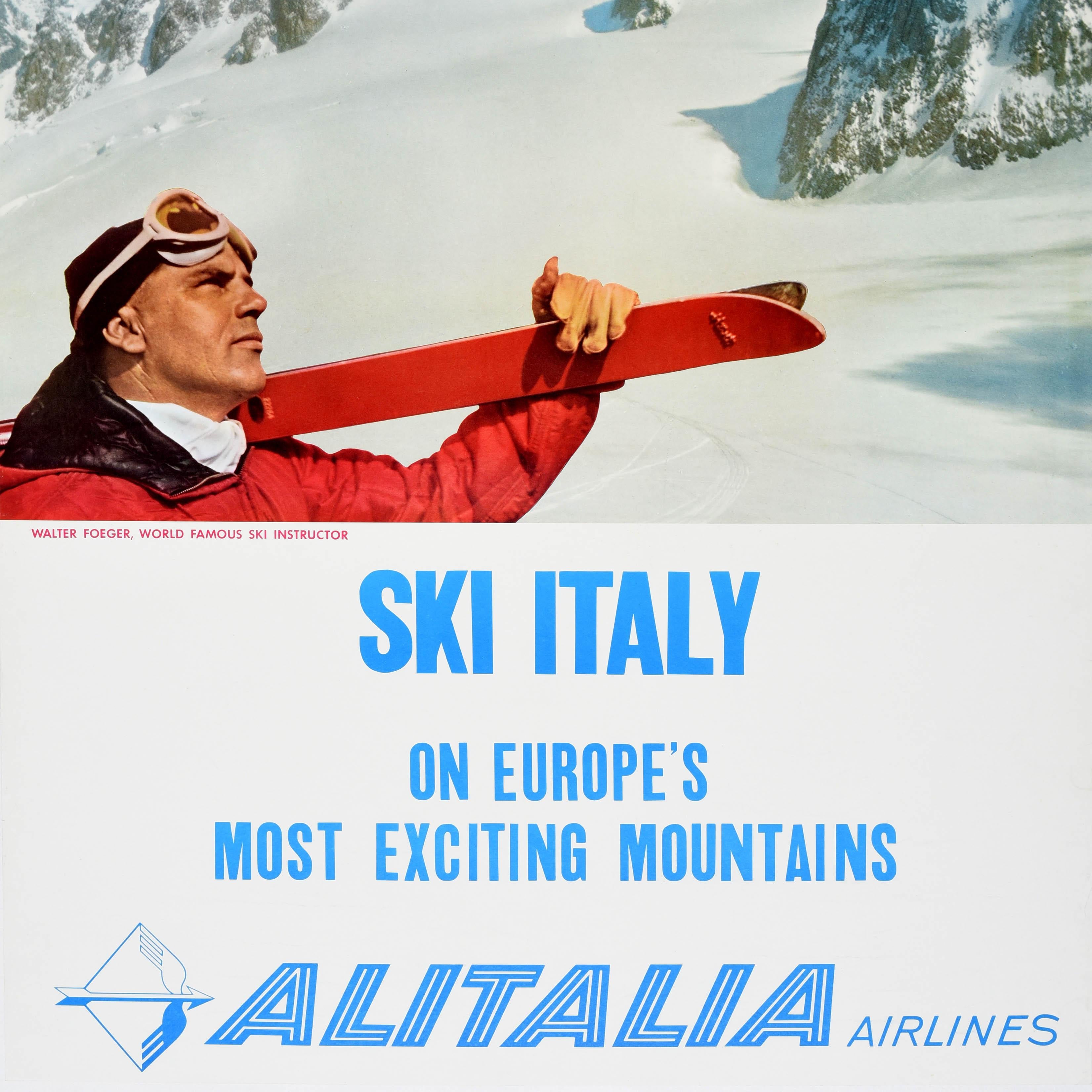 Original vintage skiing travel poster - Ski Italy on Europe's Most Exciting Mountains Alitalia Airlines - featuring a skier with goggles on his head and holding a pair of red skis over his shoulder, looking up at the snowy mountain peaks below a