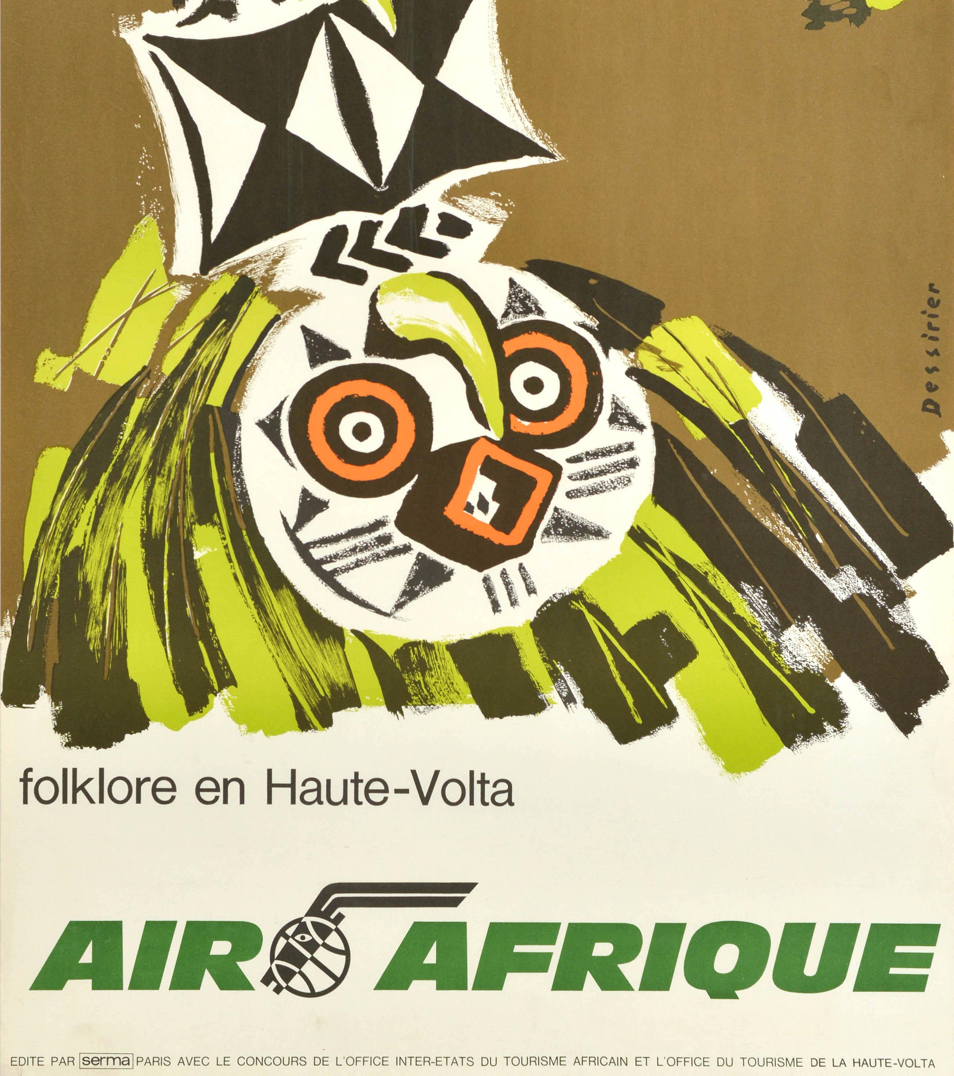 Original vintage travel poster - Air Afrique folklore en Haute-Volta / Air Africa folklore of Upper Volta - featuring an image of a traditional carved wooden totem style mask face with black and white triangle shapes and an illustration of an