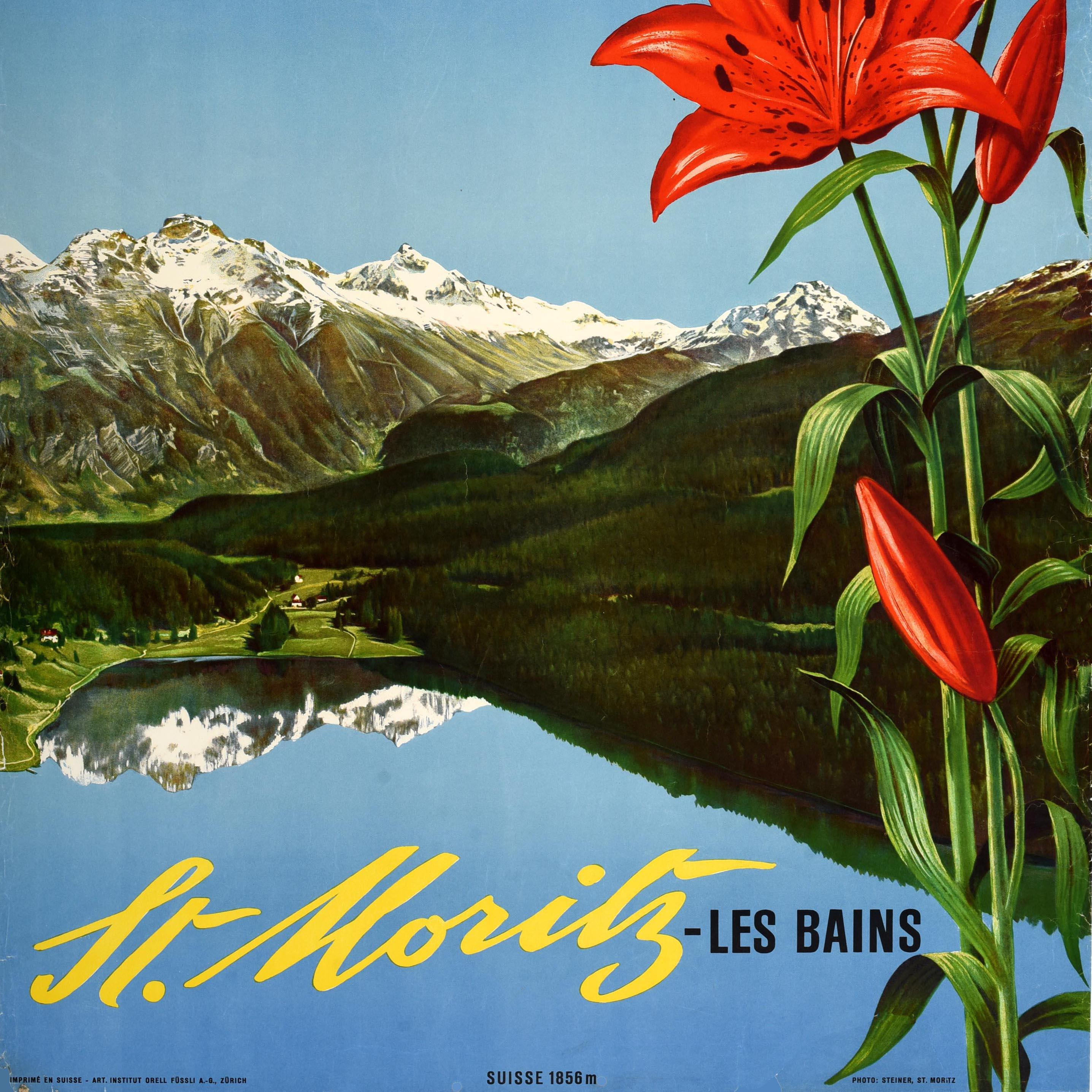 Original vintage Switzerland travel poster for St Moritz Les Bains Suisse 1856m featuring a scenic image by the notable Swiss photographer Albert Steiner (1877-1965) of a lake side village in the countryside nestled by trees on hills below snow