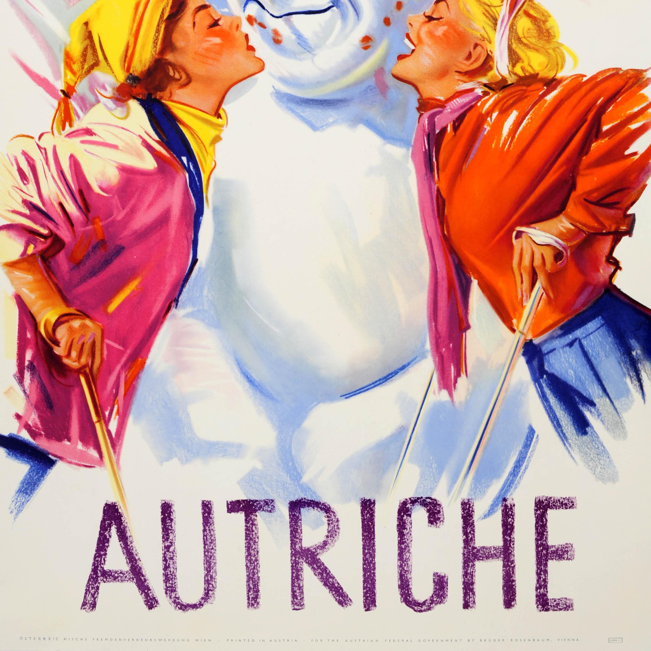 Original vintage winter sport and skiing poster for Austria / Autriche featuring a fun image of two young ladies leaning on their ski poles and covering a smiling snowman with kisses in front of the mountains and blue sky in the background. Printed