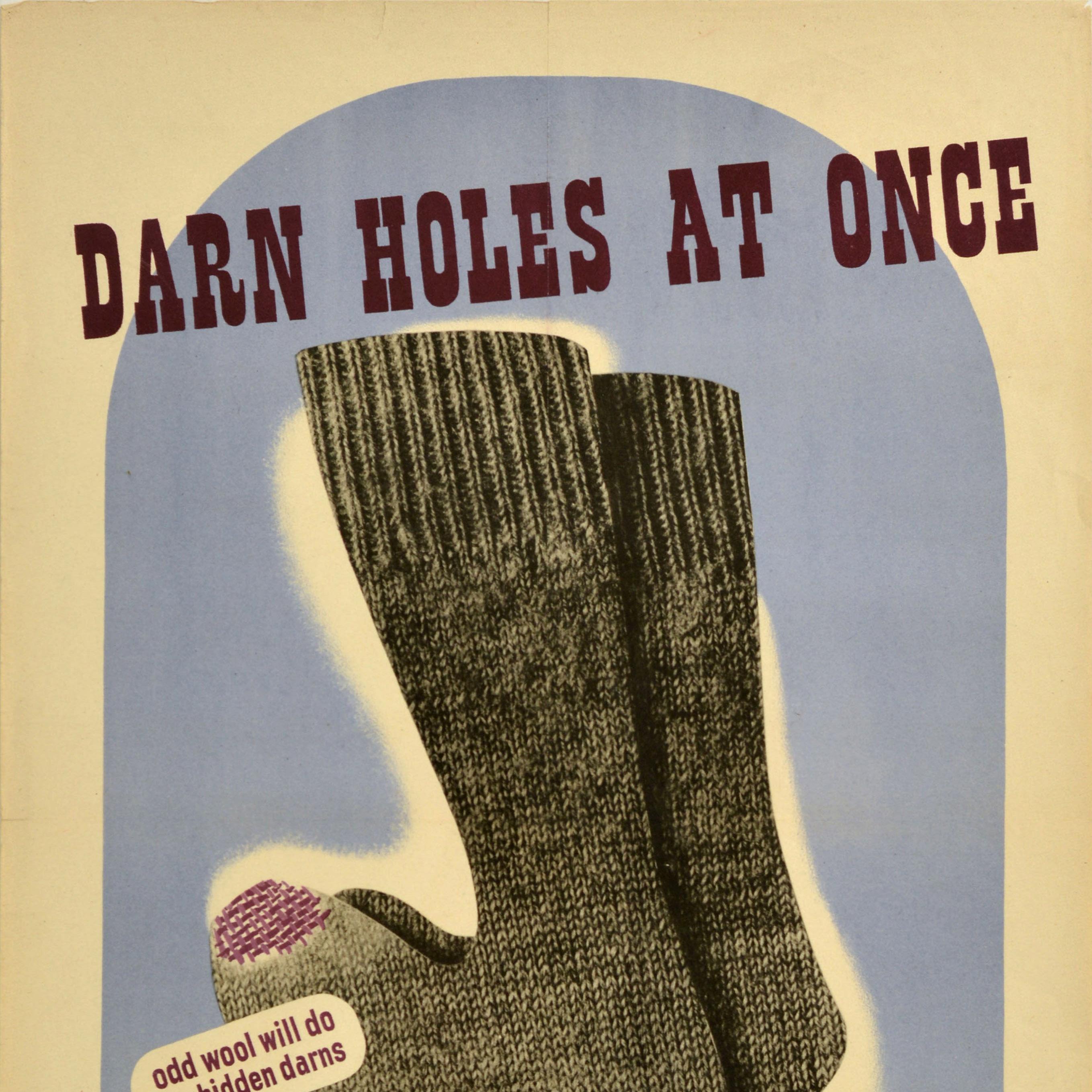Original vintage World War Two propaganda poster - Darn holes at once Odd wool will do for hidden darns Little holes soon grow into big ones if left undarned a stitch in time saves coupons - featuring an illustration of a pair of grey wool socks