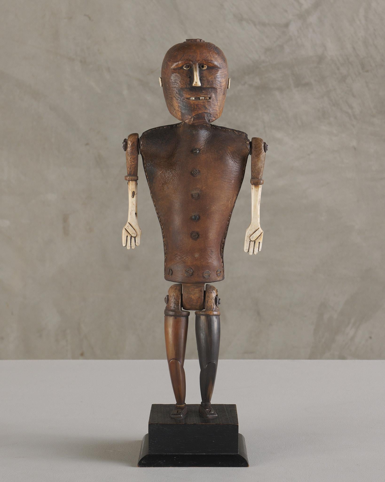 An expressive hand-carved folk art wooden figure of a man. Full of charm and character, this piece captures the spirit of authentic craftsmanship and rustic artistry.