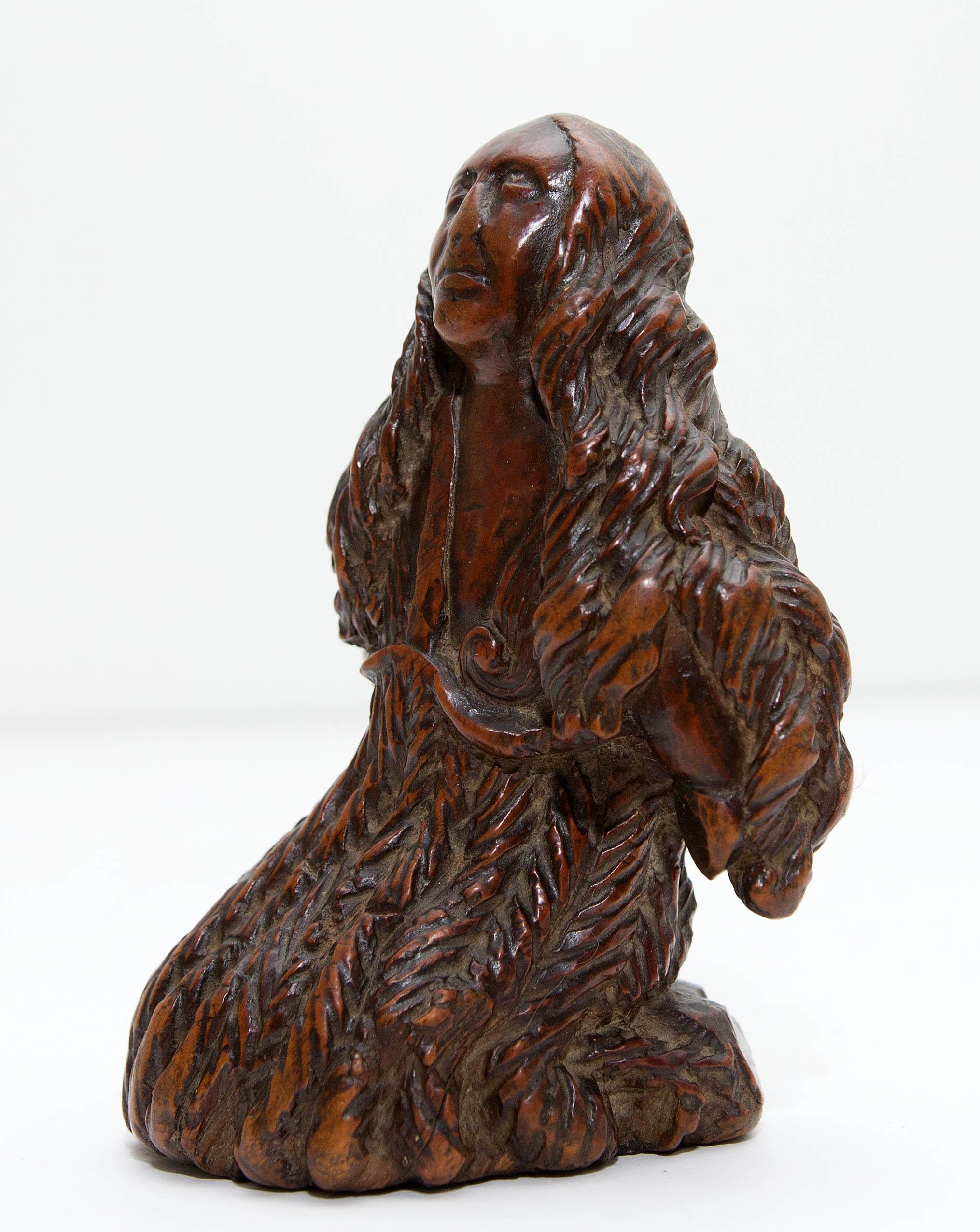 Antique carving of a saint or martyr. 17th century Flemish hardwood carving. Wonderful wear and rich color.